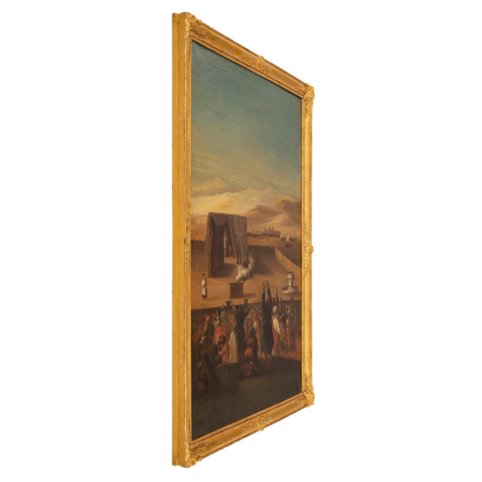A striking Italian 19th century oil on canvas painting in its original giltwood frame. The painting is framed within a beautiful and most elegant mottled giltwood border with a fine Coeur de Rai band, richly carved charming floral movements and