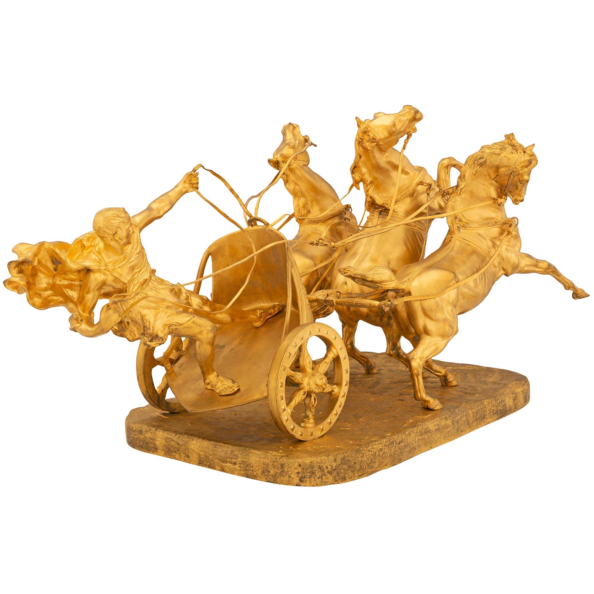 An impressive and extremely high quality Italian 19th century ormolu statue signed Vanetti. The statue is raised by a rectangular base with a wonderfully executed ground design where a Roman gladiator is riding his chariot pulled by three horses. He