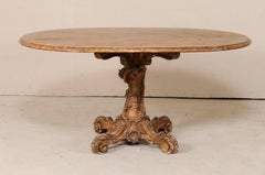 Italian 19th Century Oval Pedestal Table with Carved Wood Base in Warm Hues