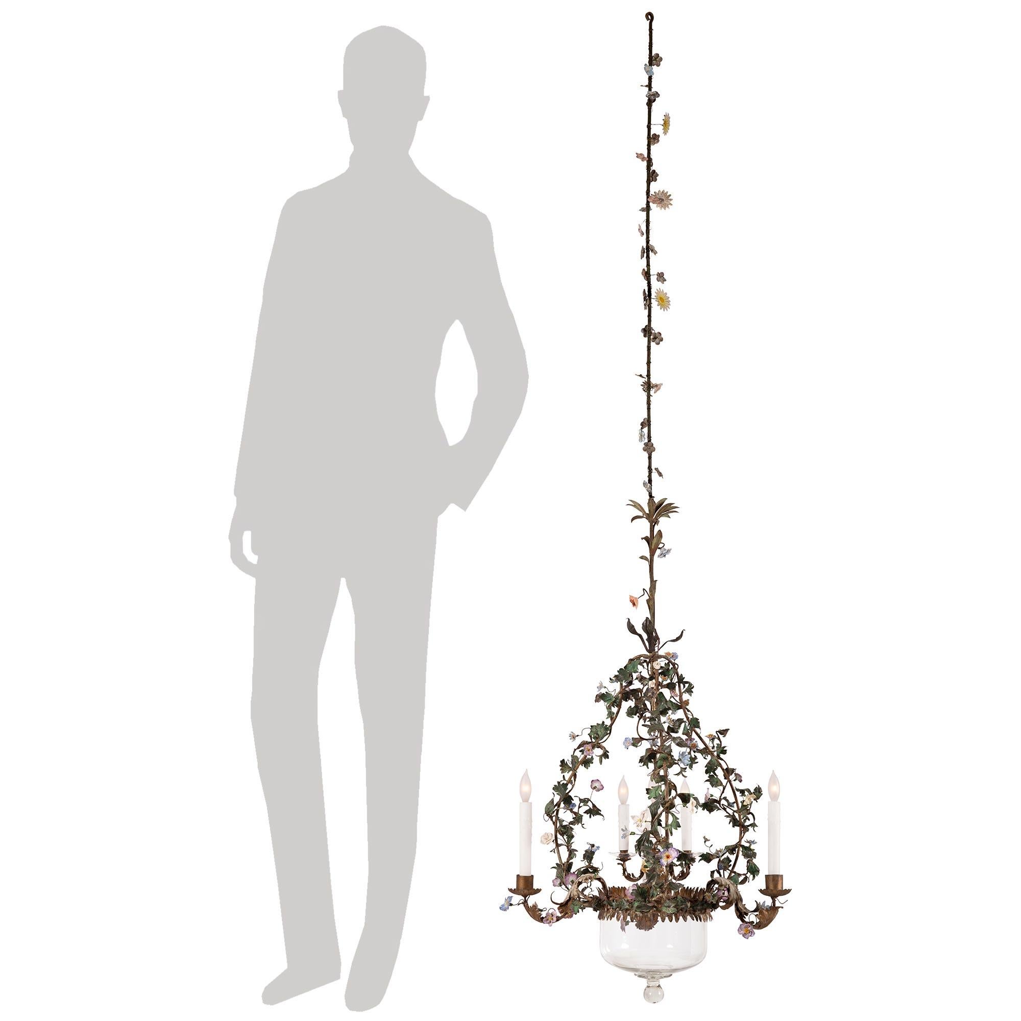 A beautiful and most charming Italian 19th century Louis XVI st. Saxe porcelain, glass, tole, and gilt metal chandelier. The six arm chandelier is centered by its original most decorative glass dome with a finely mottled bottom finial. At the center