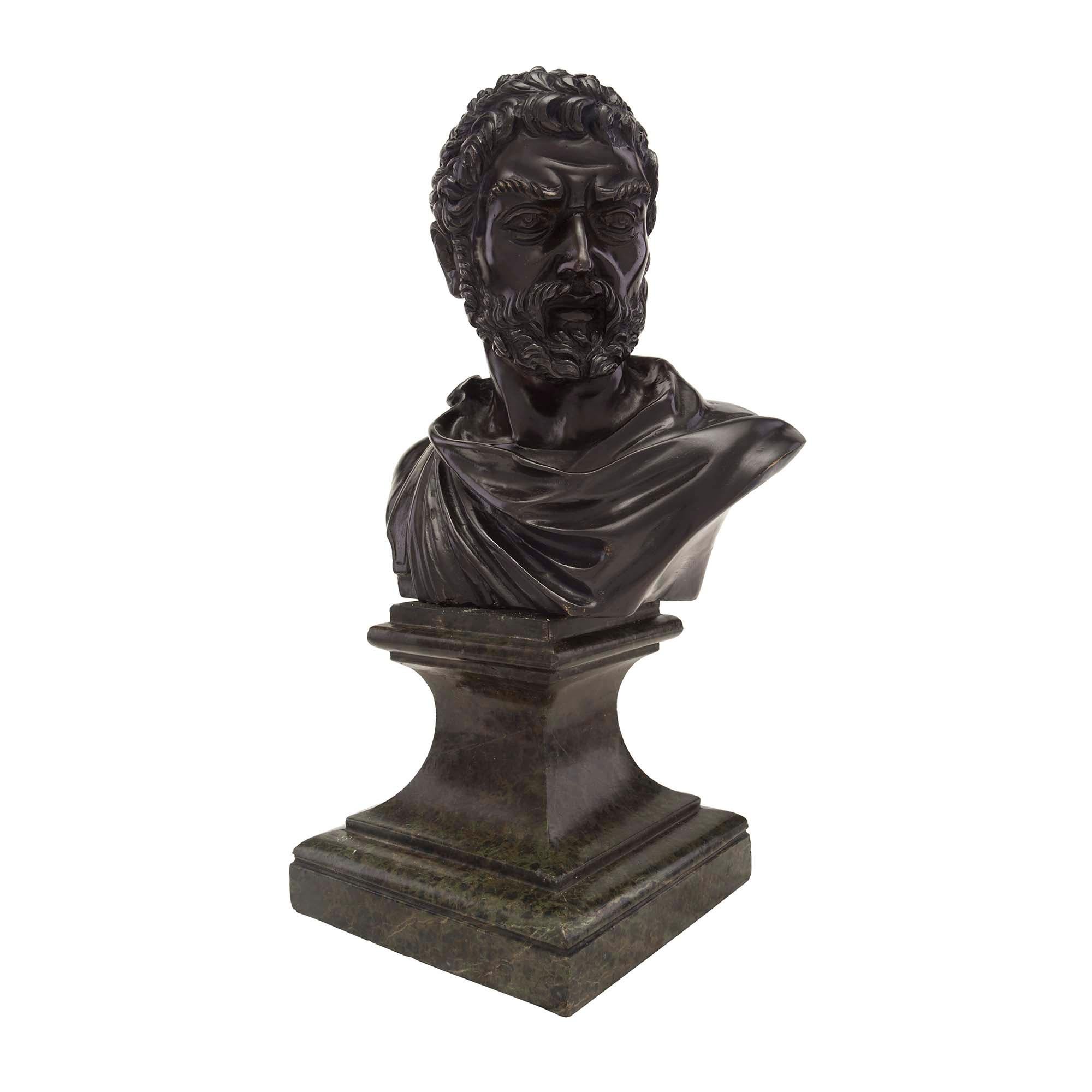 An impressive Italian 19th century patinated bronze and marble bust of a Roman Centurion signed P. Mormile. The bust is raised by a square Vert. de Patricia marble base with a most decorative mottled border and concave pedestal design. The patinated