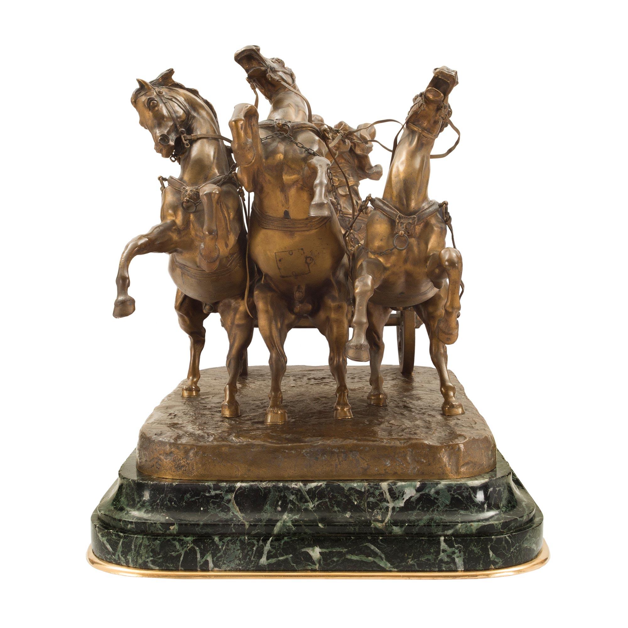 A stunning Italian 19th century patinated bronze and marble sculpture signed Vanetti. The statue is raised on a mottled rectangular Vert Patricia marble base with an elegant bottom ormolu band. Above is a most impressive Roman gladiator in classic