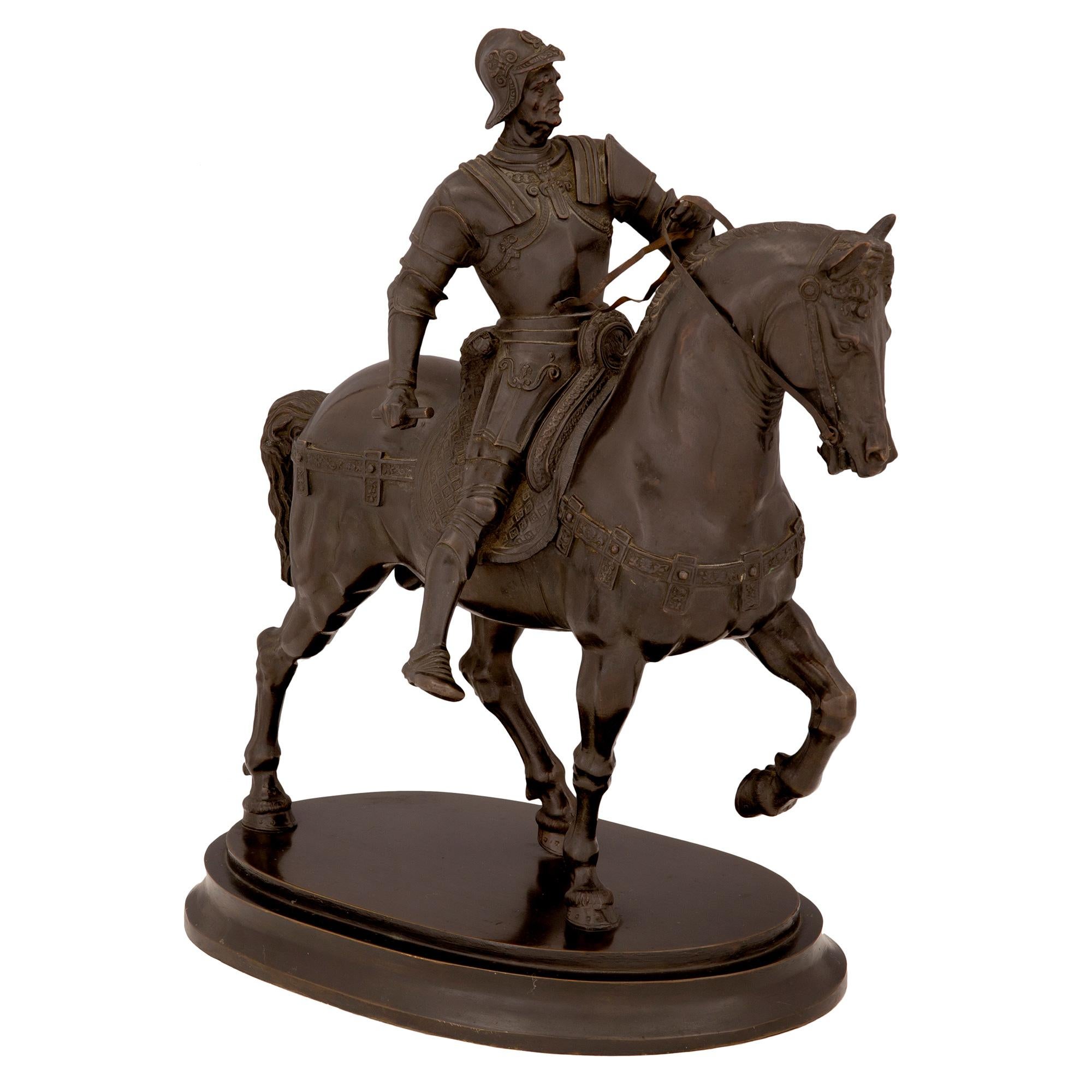 An exceptional and high quality Italian 19th century patinated bronze statue of a nobleman 'Condottiero Bartolomeo Colleoni' on his horse. The statue is raised by an elegant oval base with a fine mottled border. Above is Condottiero Colleoni,
