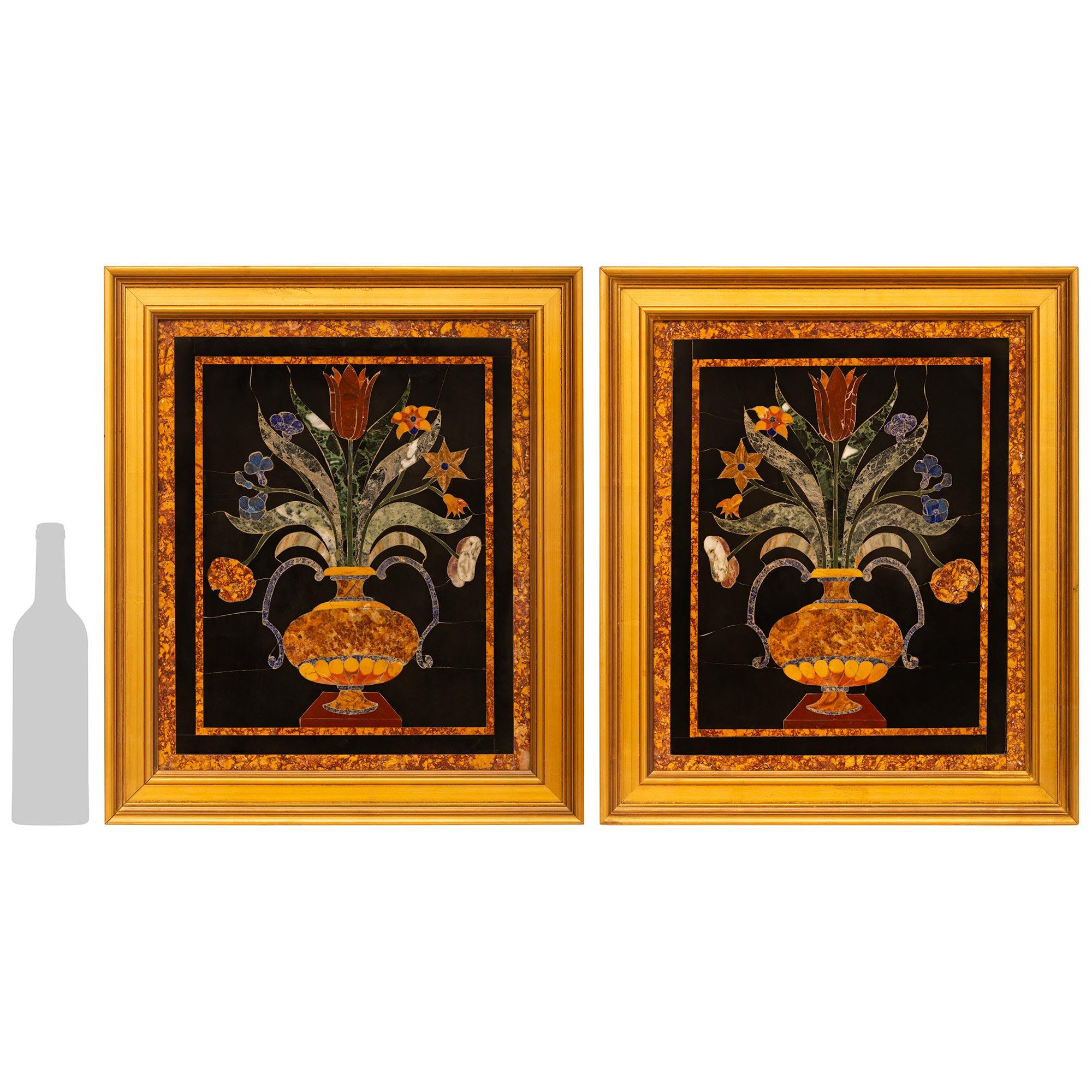 A most decorative and high quality pair of Italian 19th century Pietra Dura marble plaques. Each stunning Pietra Dura plaque is made with a Black Belgian marble background and double edged with Giallo Antico marble.  Inside the Giallo Antico marble