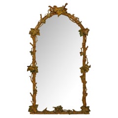 Italian 19th century Polychrome, patinated Wood and Gilt mirror