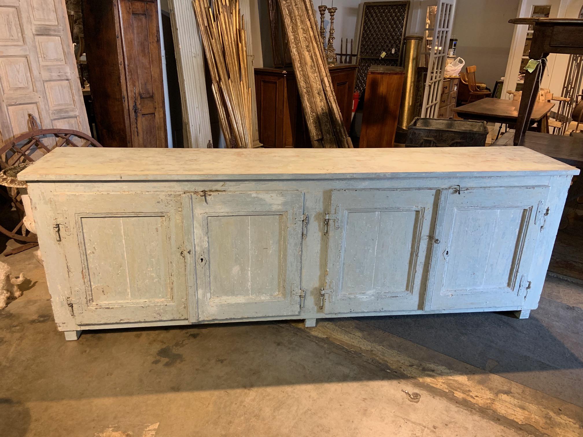 A very handsome Primitive credenza from Northern Italy. Soundly constructed from painted wood. Super patina. A terrific storage piece for any casual living area.