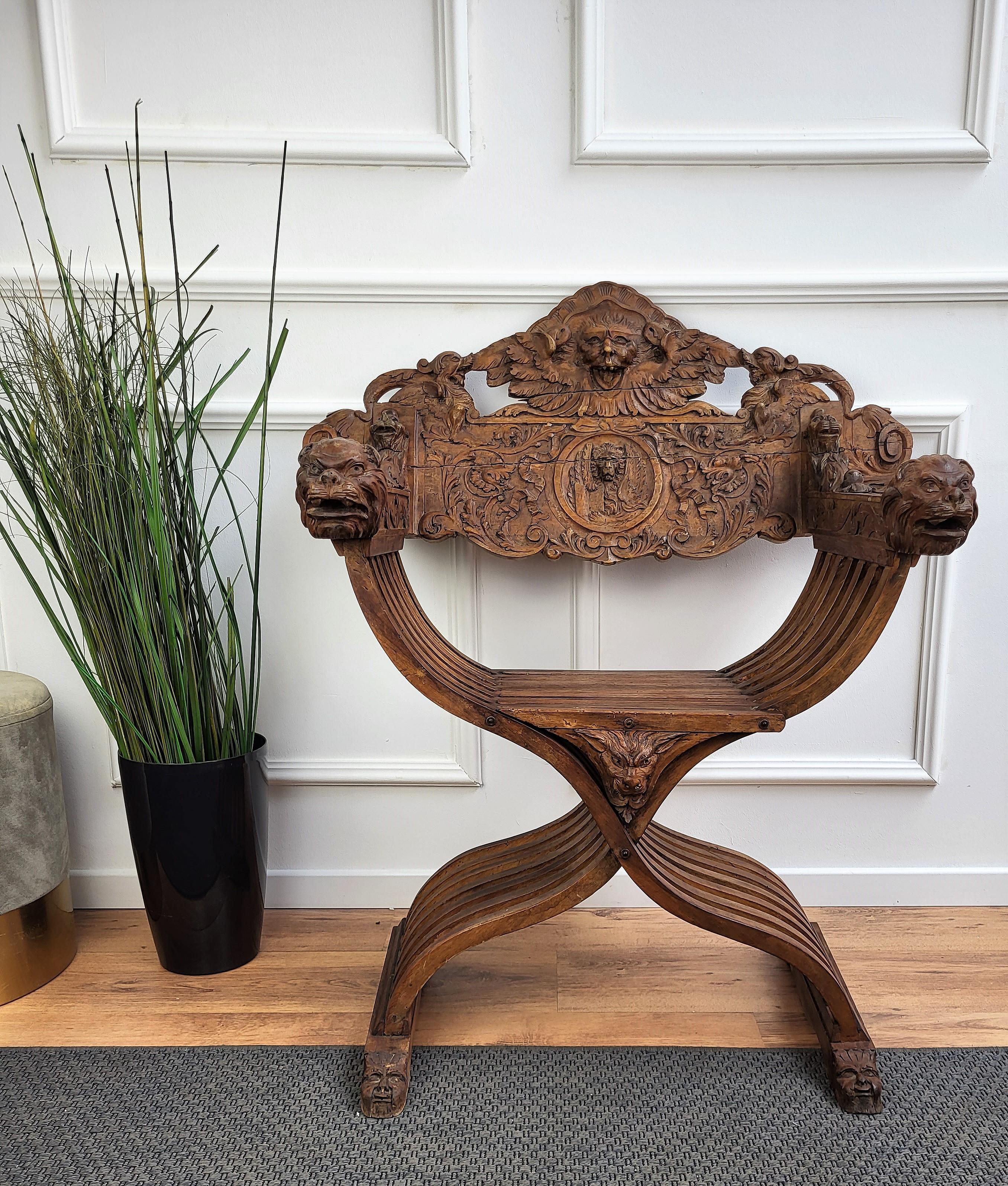Impressive and fully original Renaissance Savonarola chair in amazingly carved walnut, it looks simply stunning. The backrail, the armrests start and ending, the front and back feet, the central crossing are all decorated with incredibly hand-carved