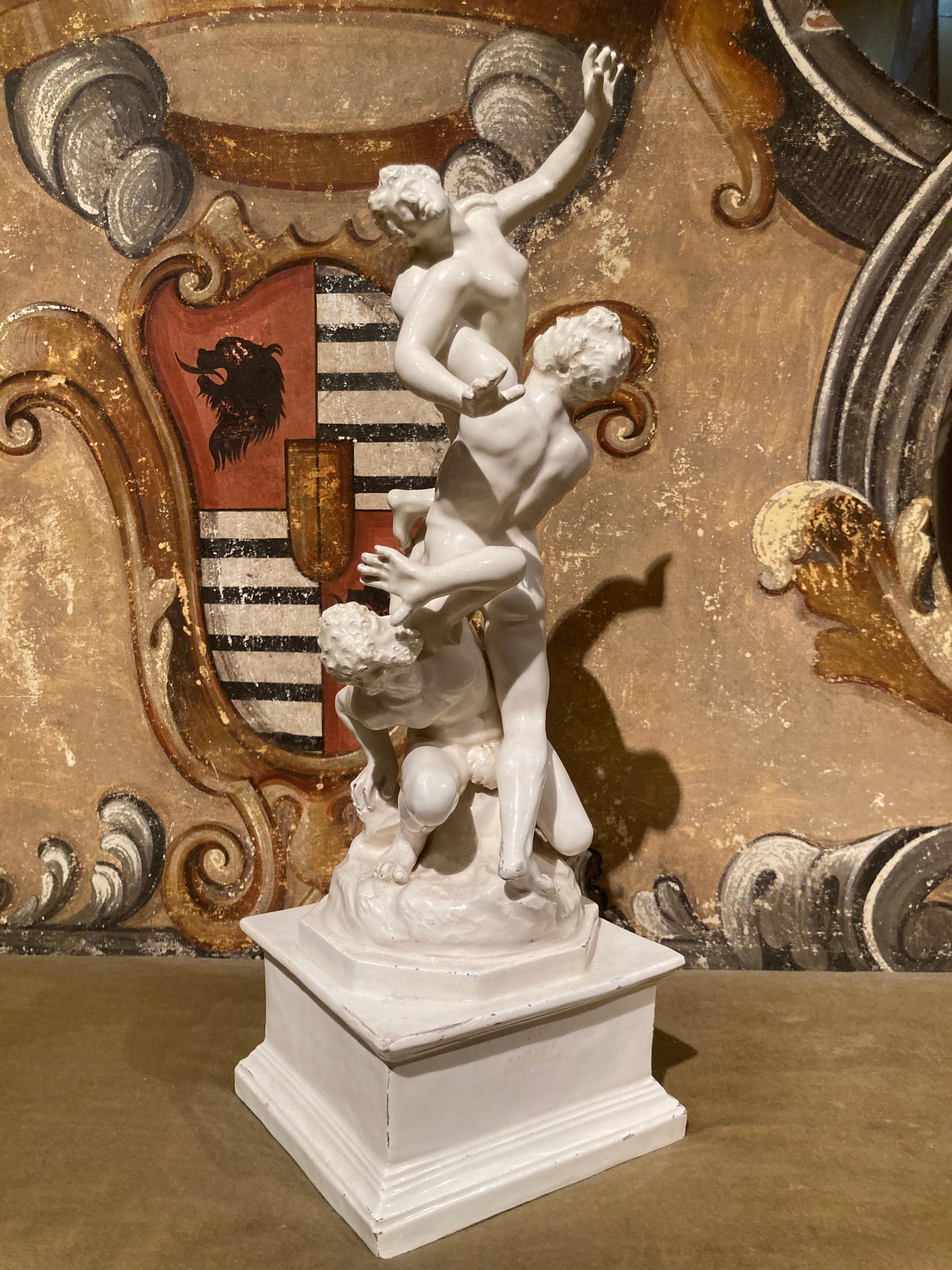 This compelling Italian 19th century white glazed porcelain sculpture depicts ‘The Rape of the Sabines’, after a monumental work by the Renaissance artist, Giambologna (1529-1608) that can still be viewed in the Loggia dei Lanzi, Piazza della