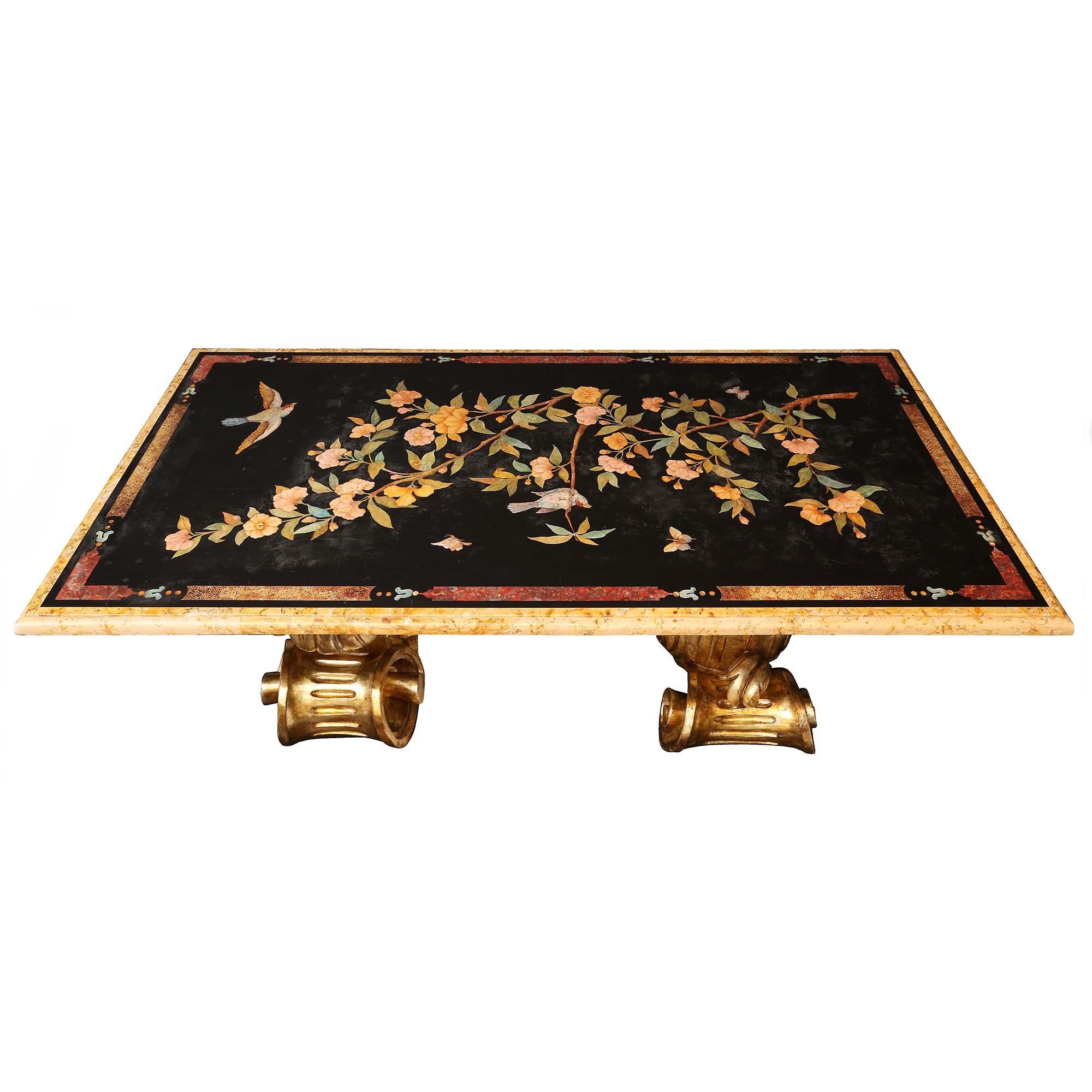 A stunning Italian 19th century scagliola and mecca dining/center table. The table is raised on opulently carved mecca scrolled Baroque supports with large acanthus leaves. The rectangular scagliola top has a black background decorated with foliate