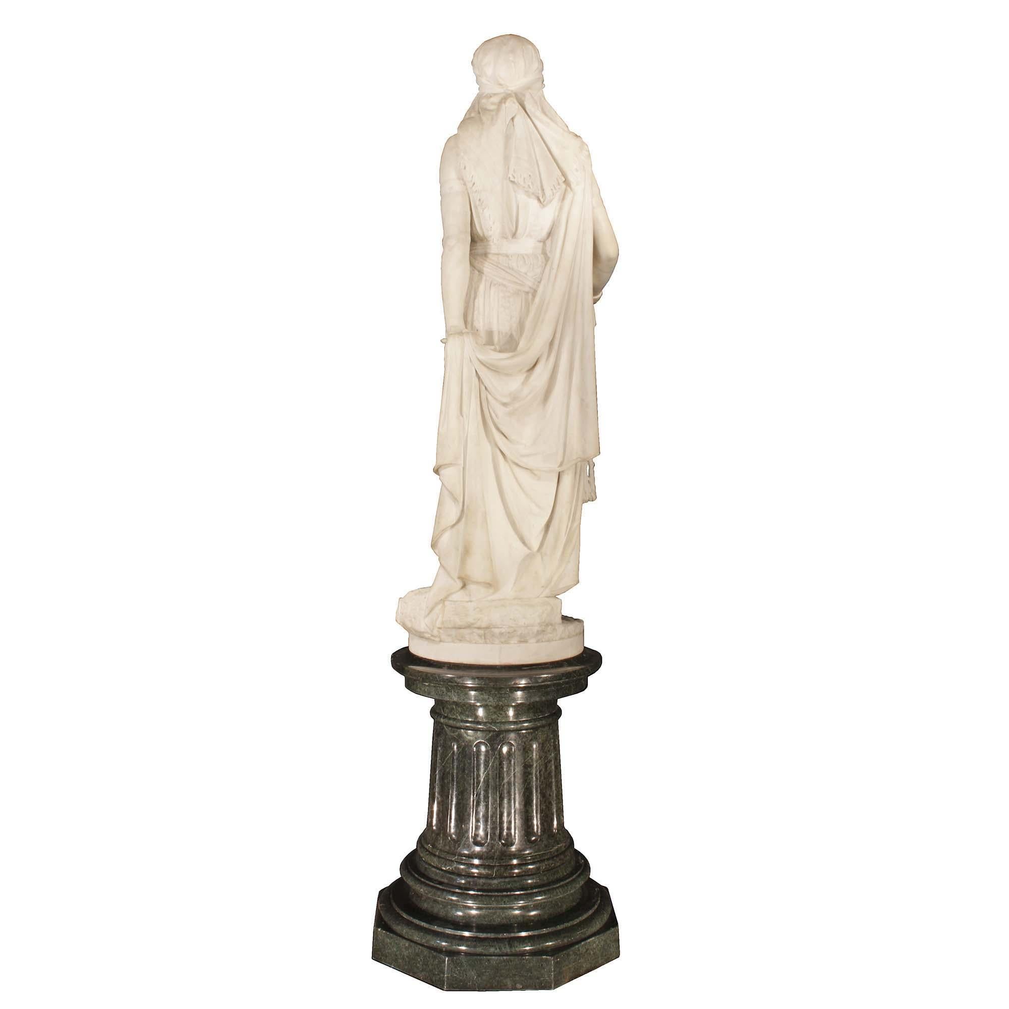A very impressive and important Italian 19th century solid white Carrera marble statue of Jael, signed Guglielmo Baldi. The statue is raised on a Vert Antique marble base. The statue is finely executed with wonderful details and expression, and Jael