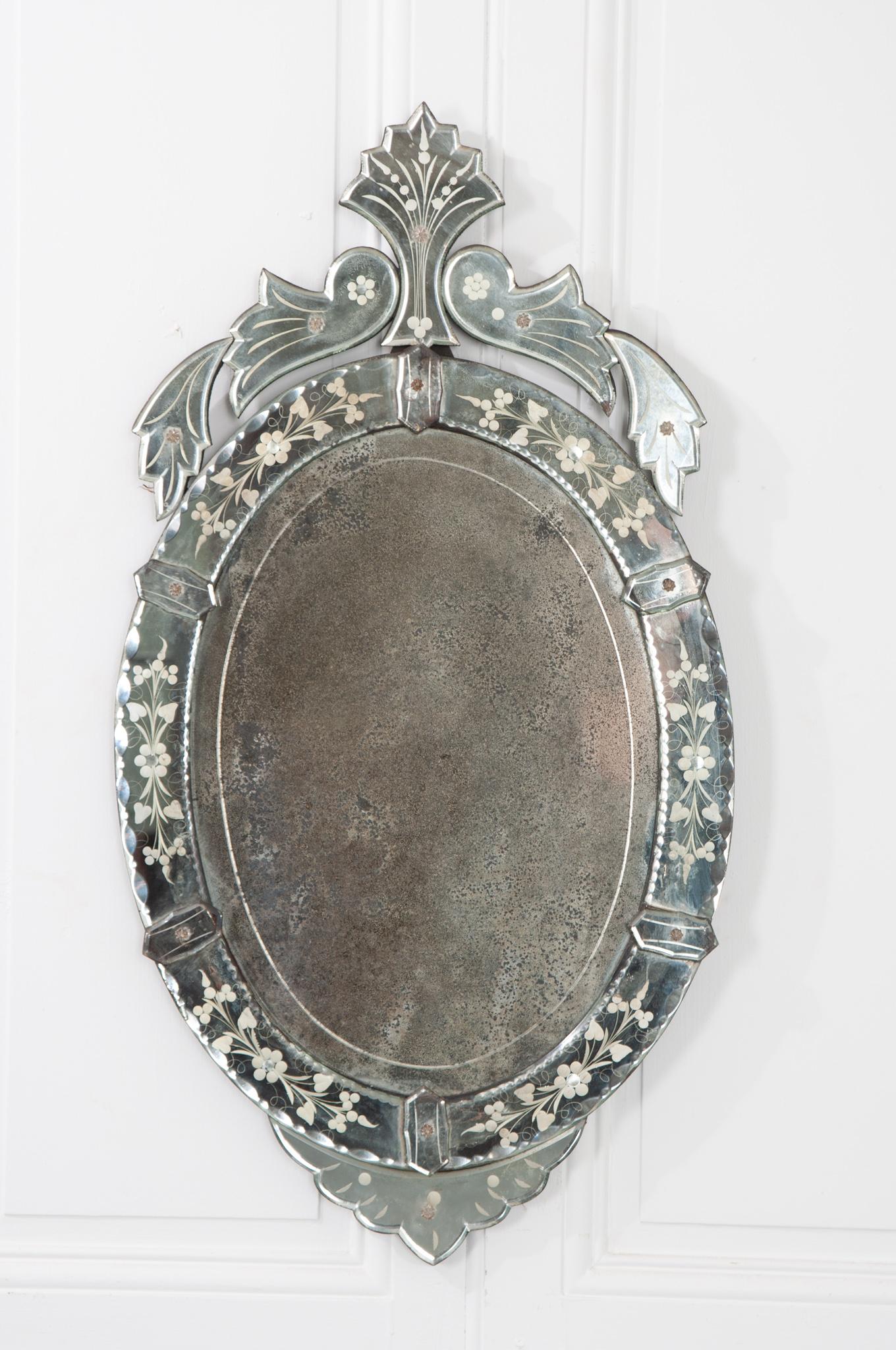 This is a lovely Venetian oval mirror from Italy. Its original plate has lots of foxing and aging. It would definitely add Old World elegance to any space. Be sure to view the detailed images.
  