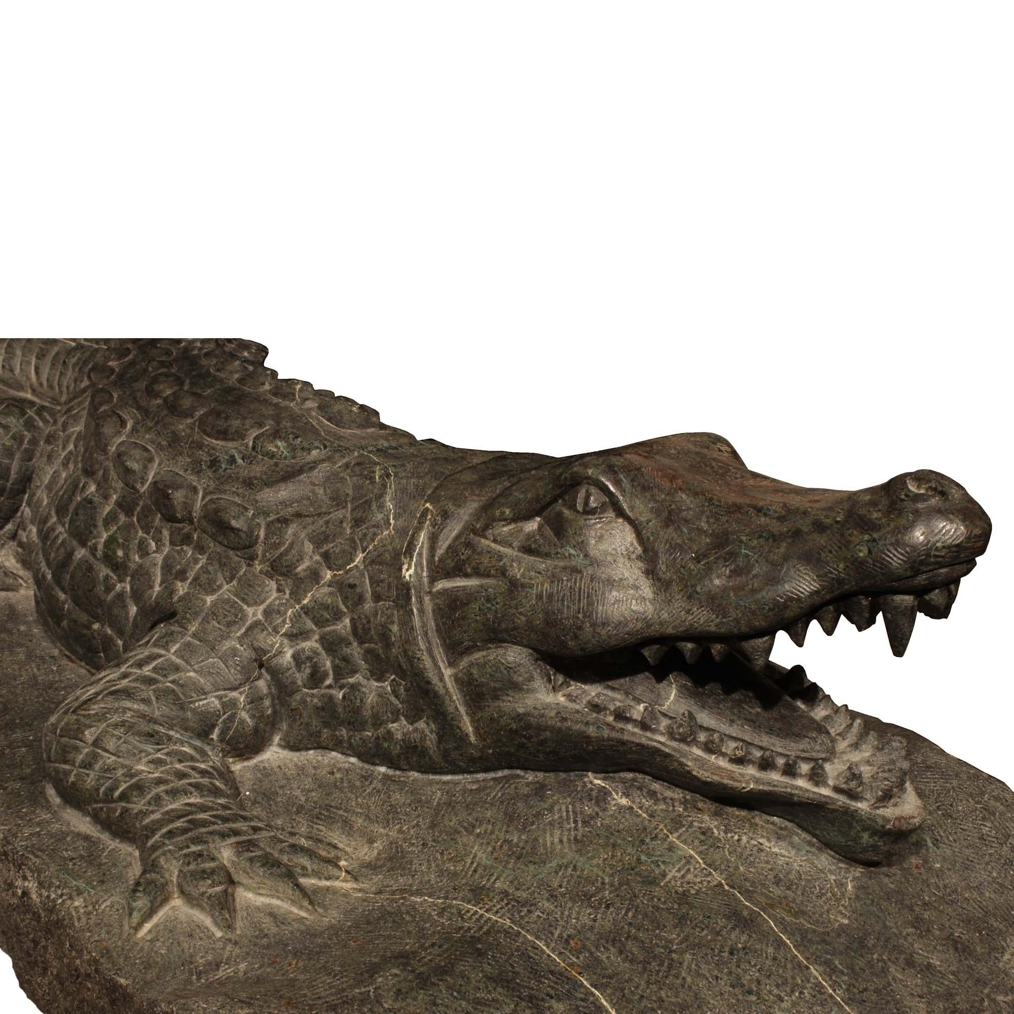 A magnificent Italian 19th century Verde Prato marble Alligator sculpture, from Florence. This exceptionally well executed marble sculpture is raised on a terrain styled base. The very impressive and intricately carved marble alligator is depicted