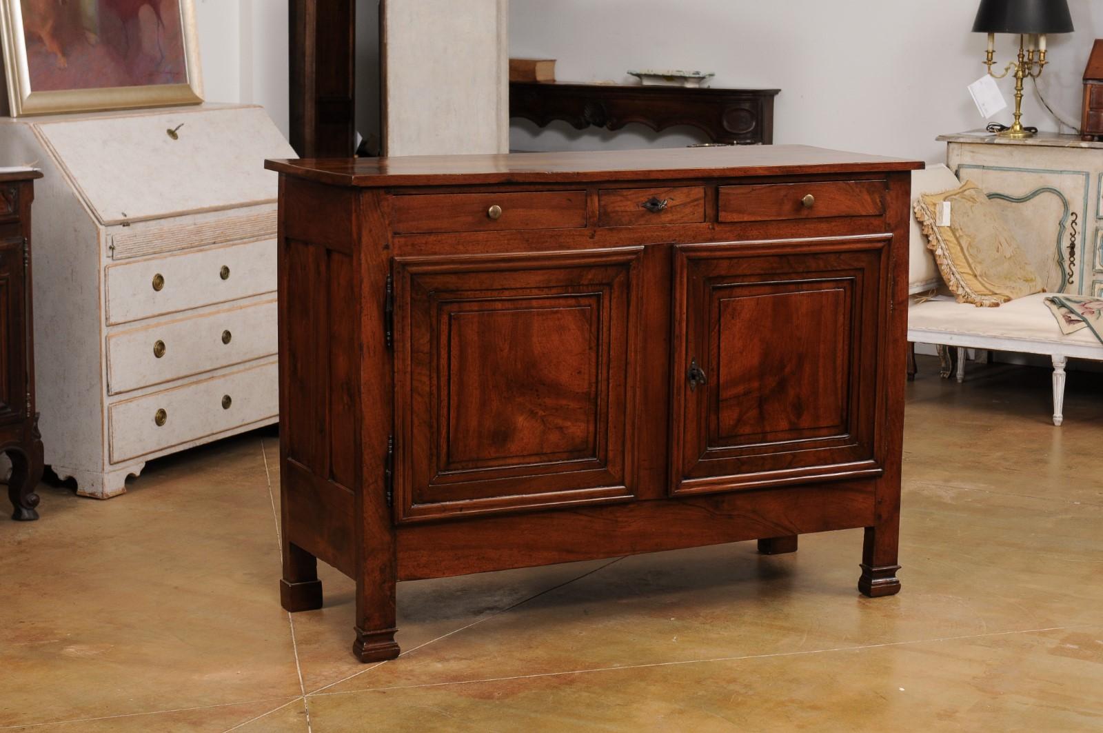 Carved Italian 19th Century Walnut Buffet with Three Drawers over Two Molded Doors For Sale