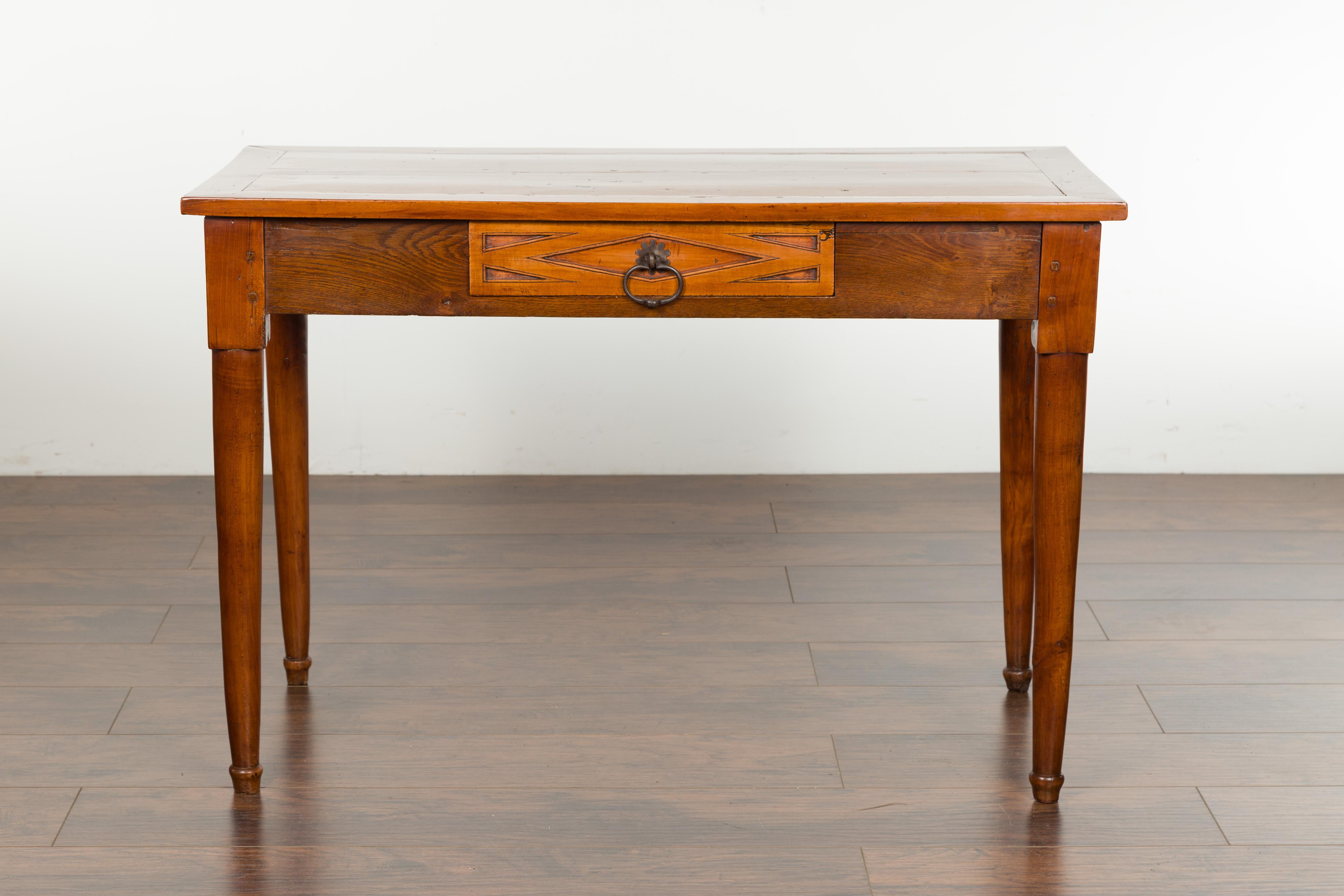 An Italian walnut console table from the 19th century, with single drawer and diamond motif. Created in Italy during the 19th century, this walnut table features a rectangular top sitting above a single dovetailed drawer. Carved in low-relief with