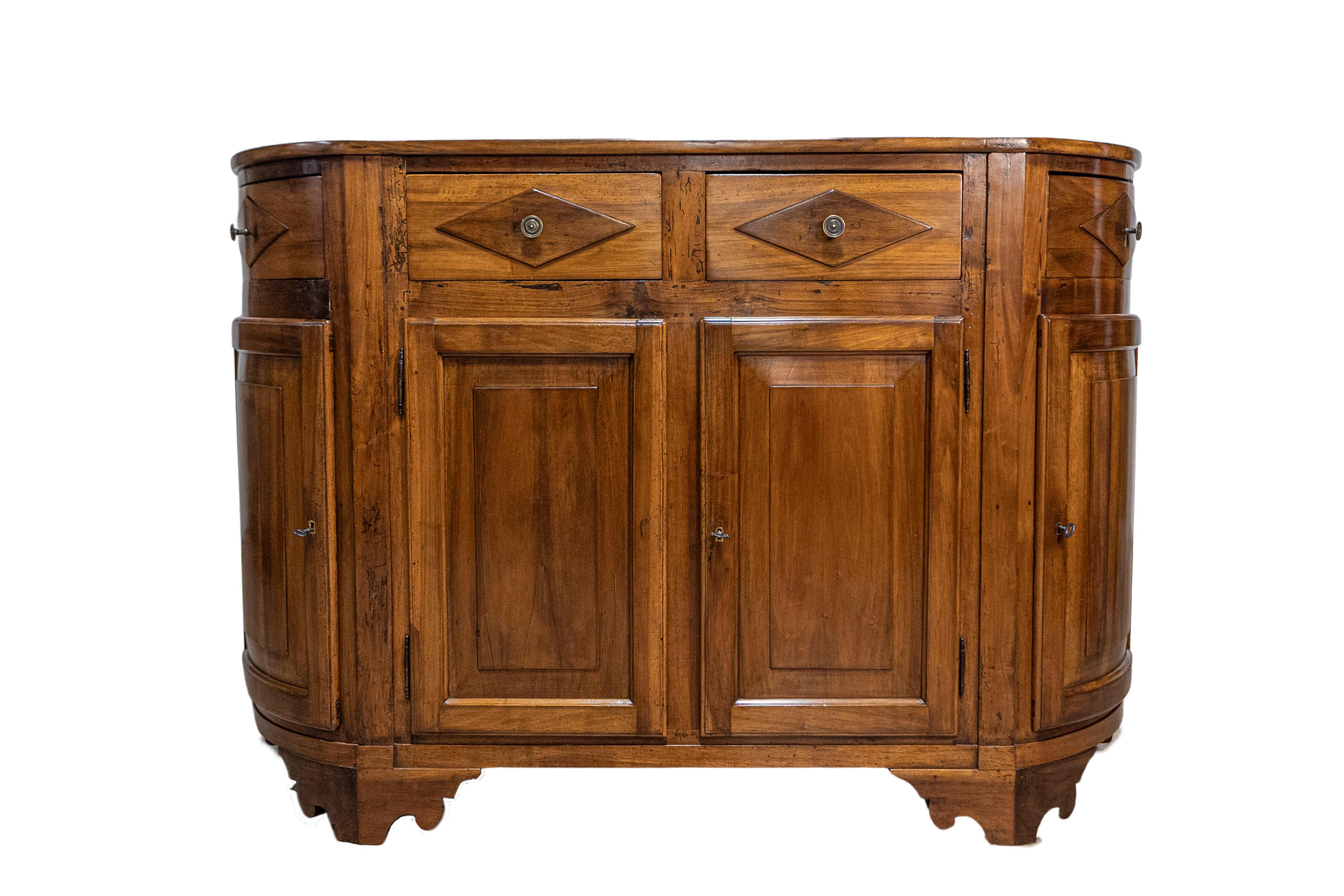 An Italian walnut credenza from the 19th century with four drawers over four doors, diamond motifs and rounded sides. This stunning 19th-century Italian walnut credenza is a magnificent example of classic craftsmanship combined with functional
