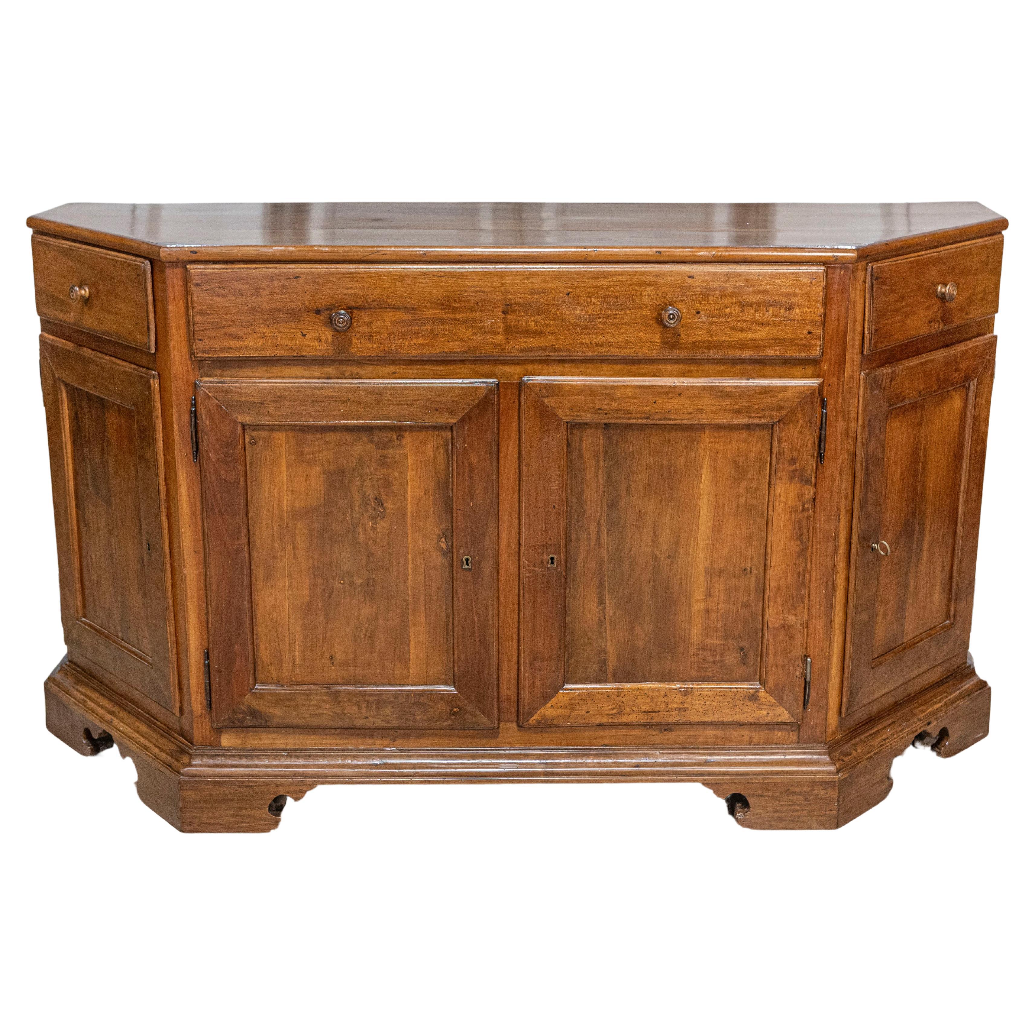 Italian 19th Century Walnut Credenza with Drawers over Doors and Canted Sides For Sale