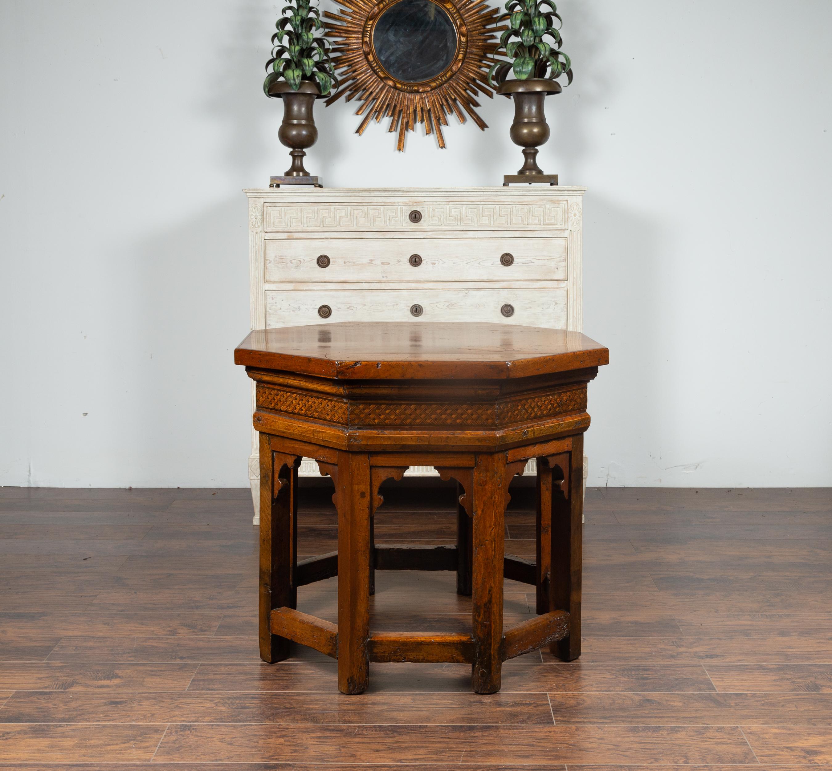 An Italian walnut octagonal center table from the mid-19th century (or earlier), with geometrical inlay. We have a near pair available with slight variations in the dimensions, please check item LU836716746111. Born in Italy during the 19th century,