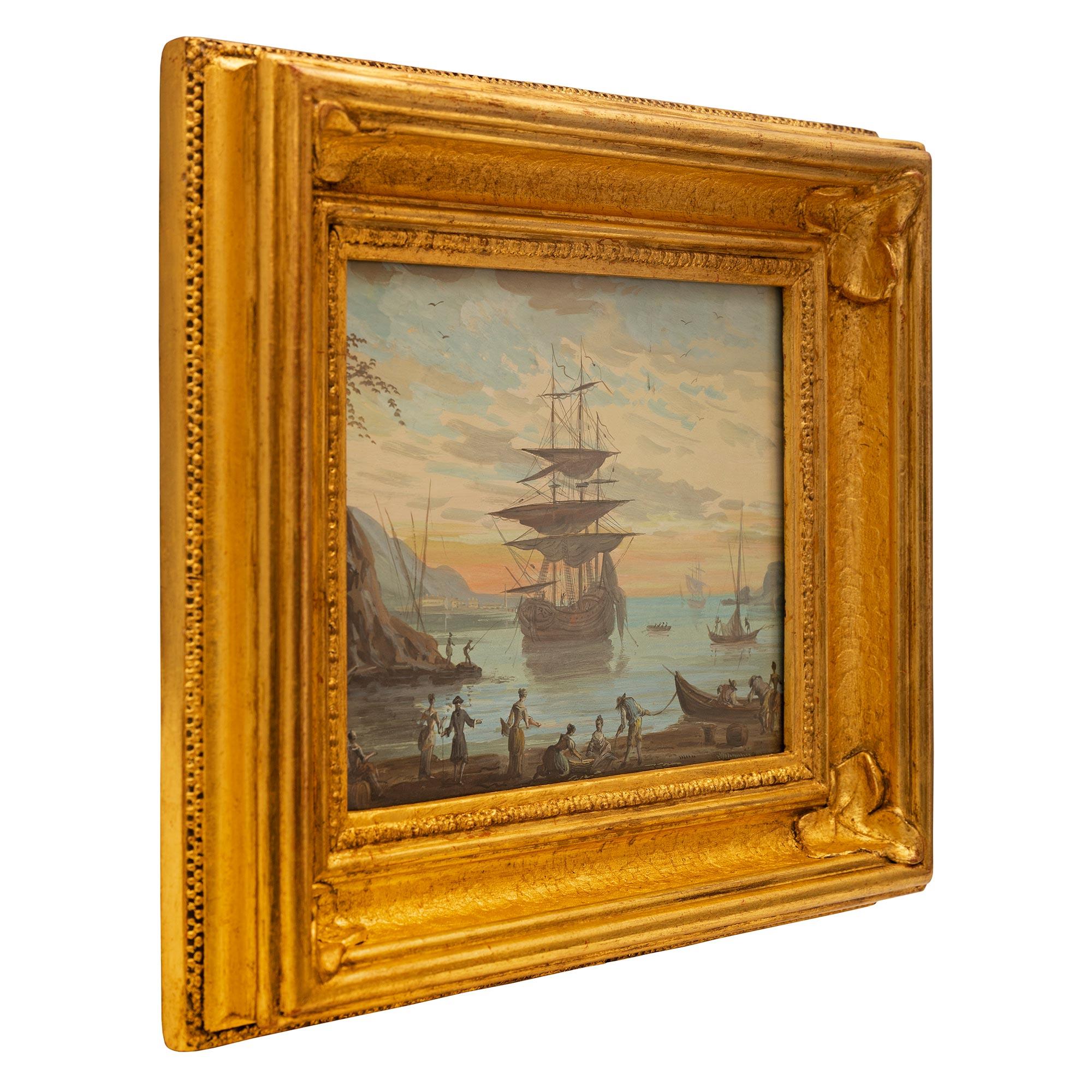 Une belle et charmante aquarelle italienne du 19ème siècle représentant la baie de Venise dans son cadre d'origine en bois doré. La peinture représente la baie de Venise au lever du soleil avec un magnifique ciel rouge en arrière-plan. Au centre se