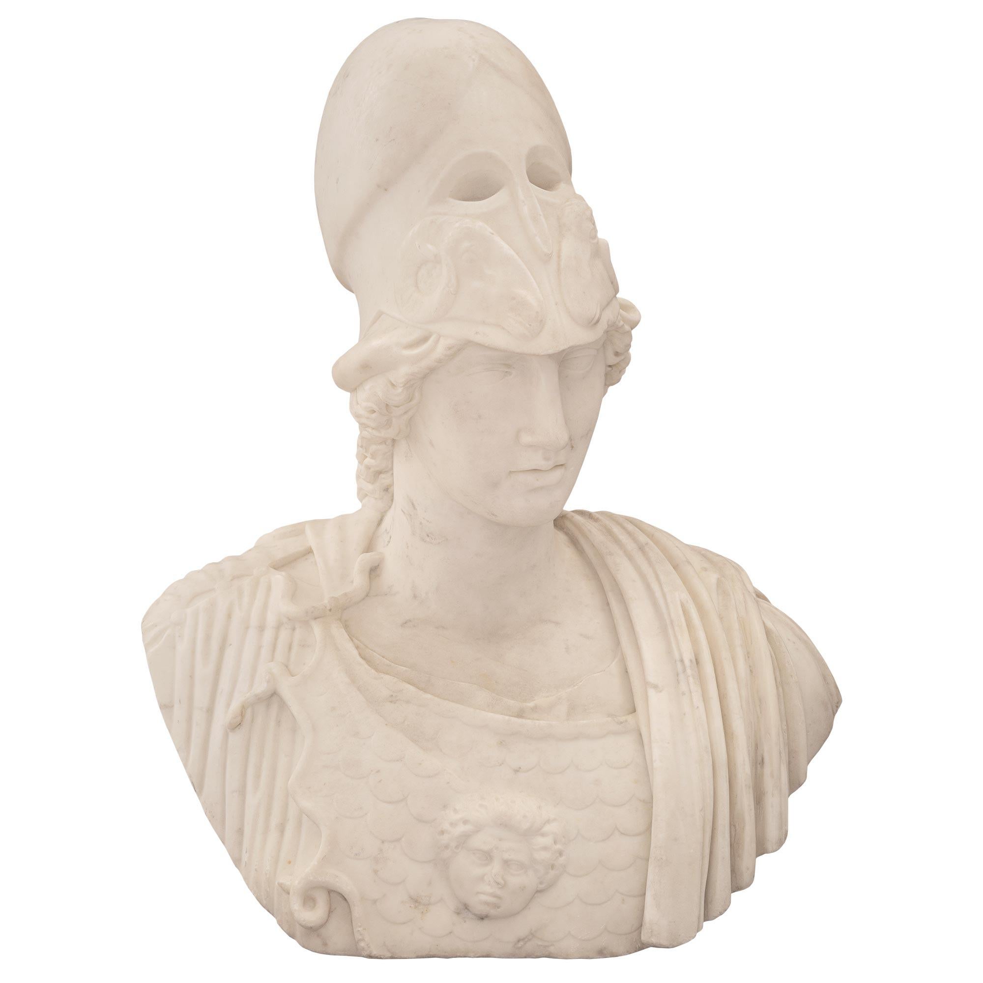 A stunning and most impressive Italian 19th century white Carrara marble bust of Athena of Velletri. The bust depicts the beautiful Athena in her armor with a wonderfully executed cloak draped over her shoulder. She wears her distinctive Corinthian