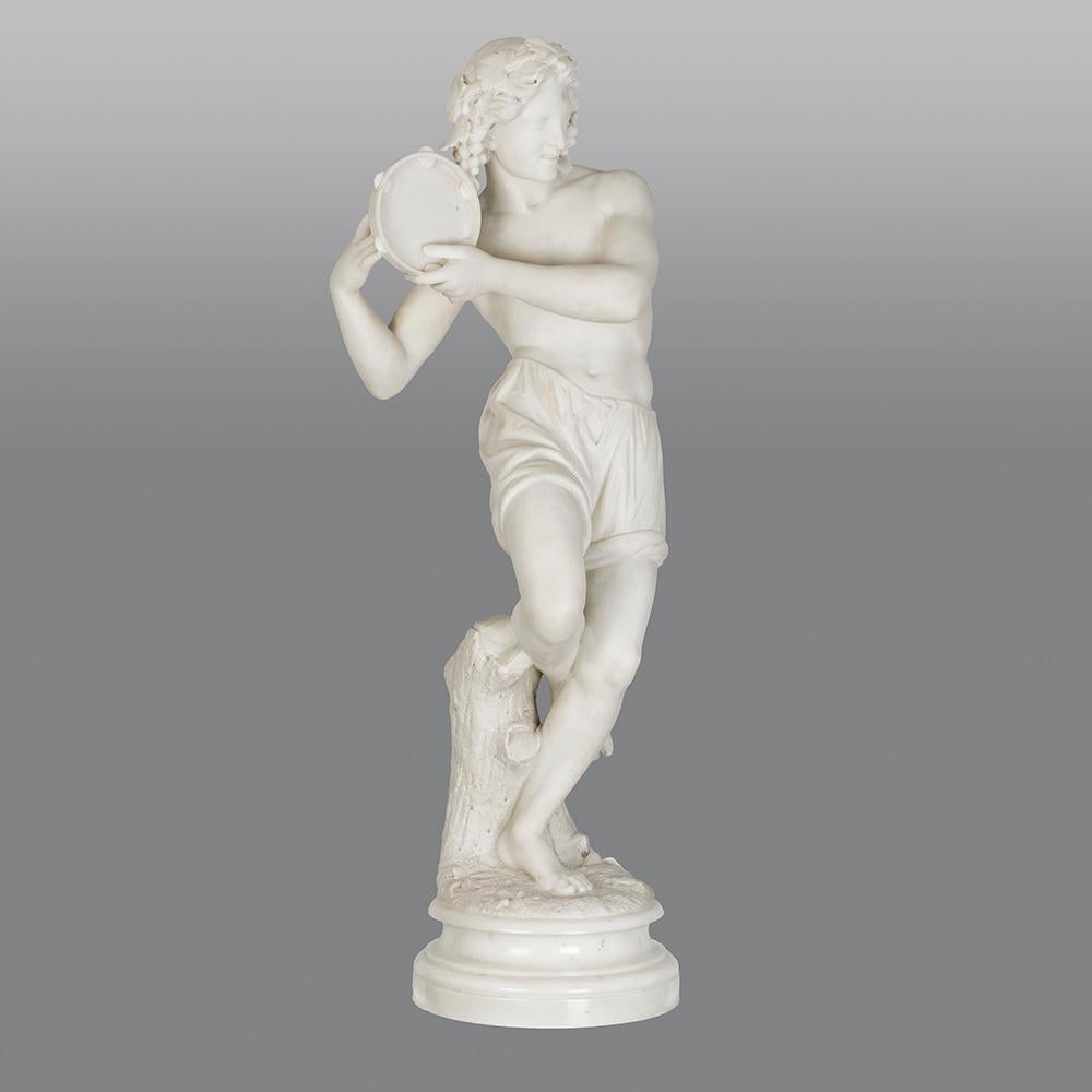 A stunning Italian 19th century white Carrara marble statue. The figure depicts a Neapolitan dancer playing a the tambourine with grapevine in his hair. The naturalistic base is signed 'G Cigoli Roma 1873'. The statue is wonderfully executed with