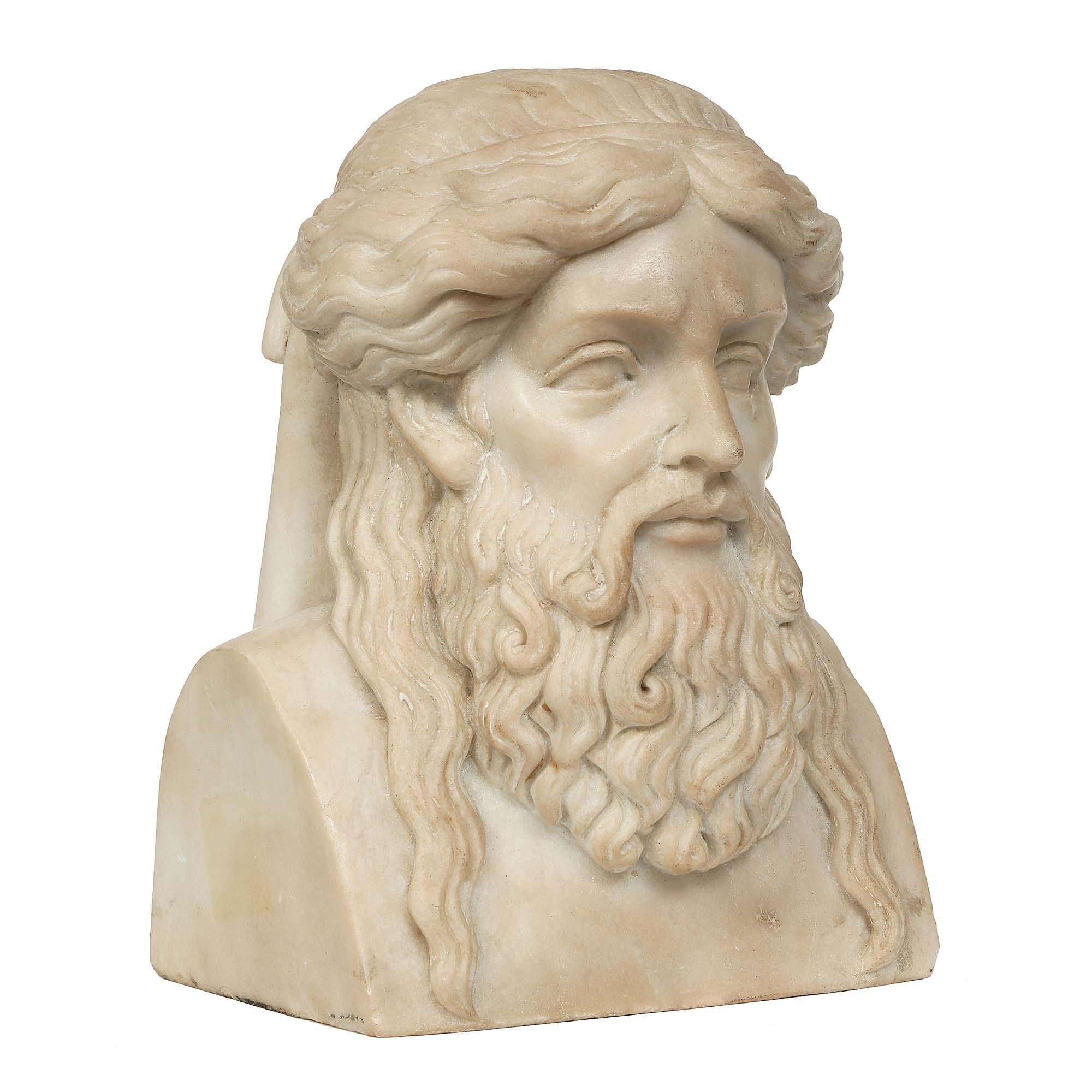 A very handsome Italian 19th century white Carrara marble finely carved bust. The bust of an Italian scholar, with full exquisitely defined beard, and long wavy hair tied in the back. Wonderful facial detail and noble expression.
 
