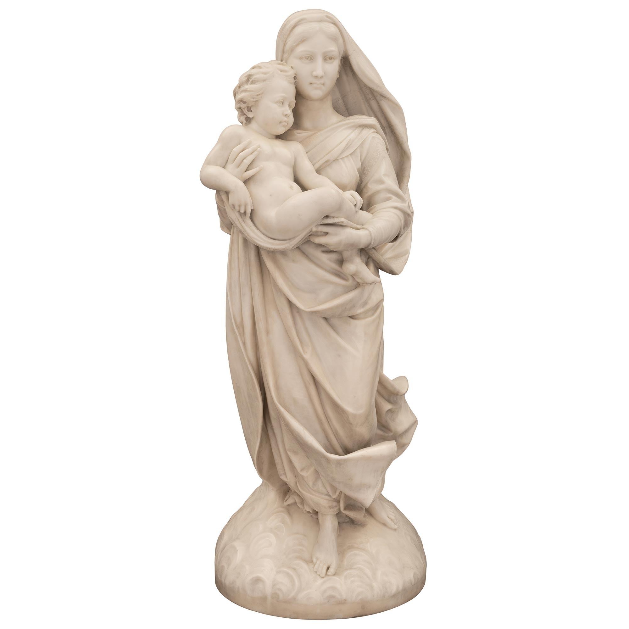 A stunning and most impressive Italian 19th century white Carrara marble life-size statue of Madonna and child. The statue signed Gria Flli Lapini 1895, is raised by a beautiful dome shape base with lovely scrolled flowing cloud like designs. Above