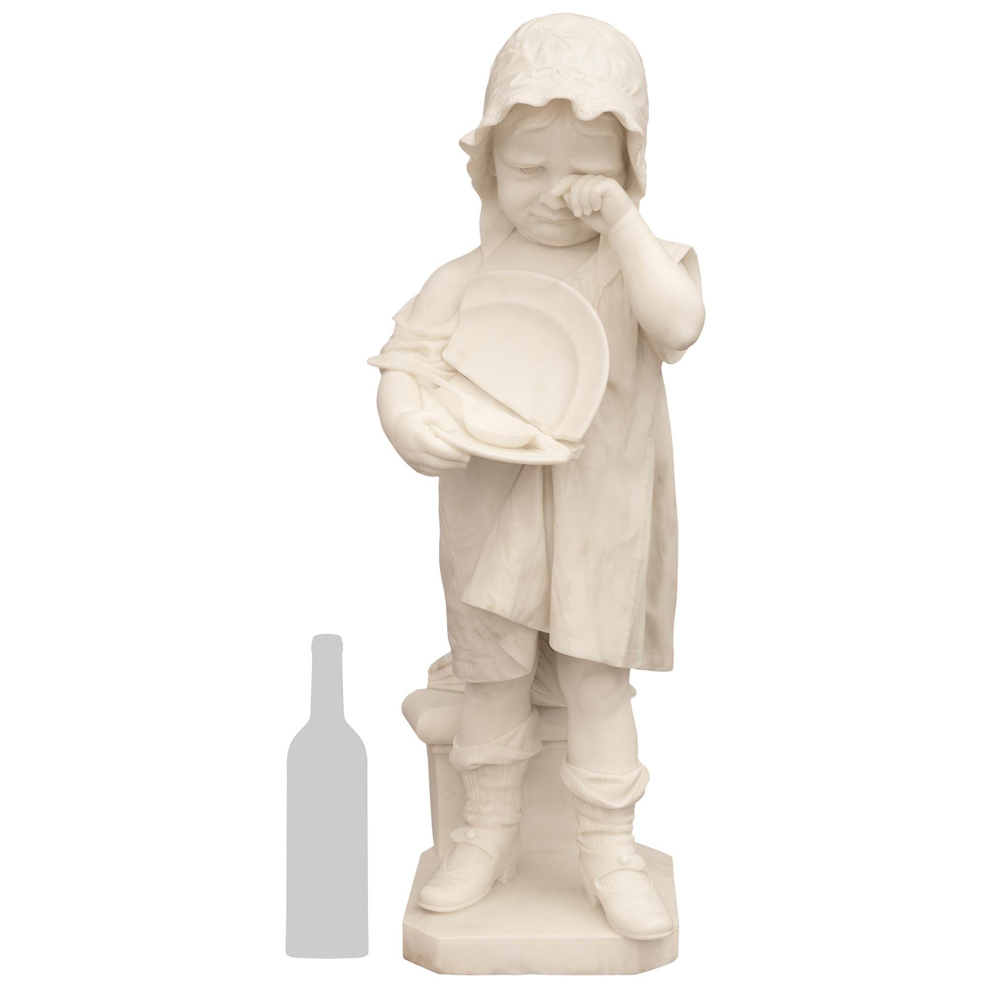 An adorable and finely detailed Italian 19th century White Carrara marble statue and Portoro marble pedestal, signed 'Galli Firenza', circa 1885. This emotional and high quality marble sculpture, entitled 