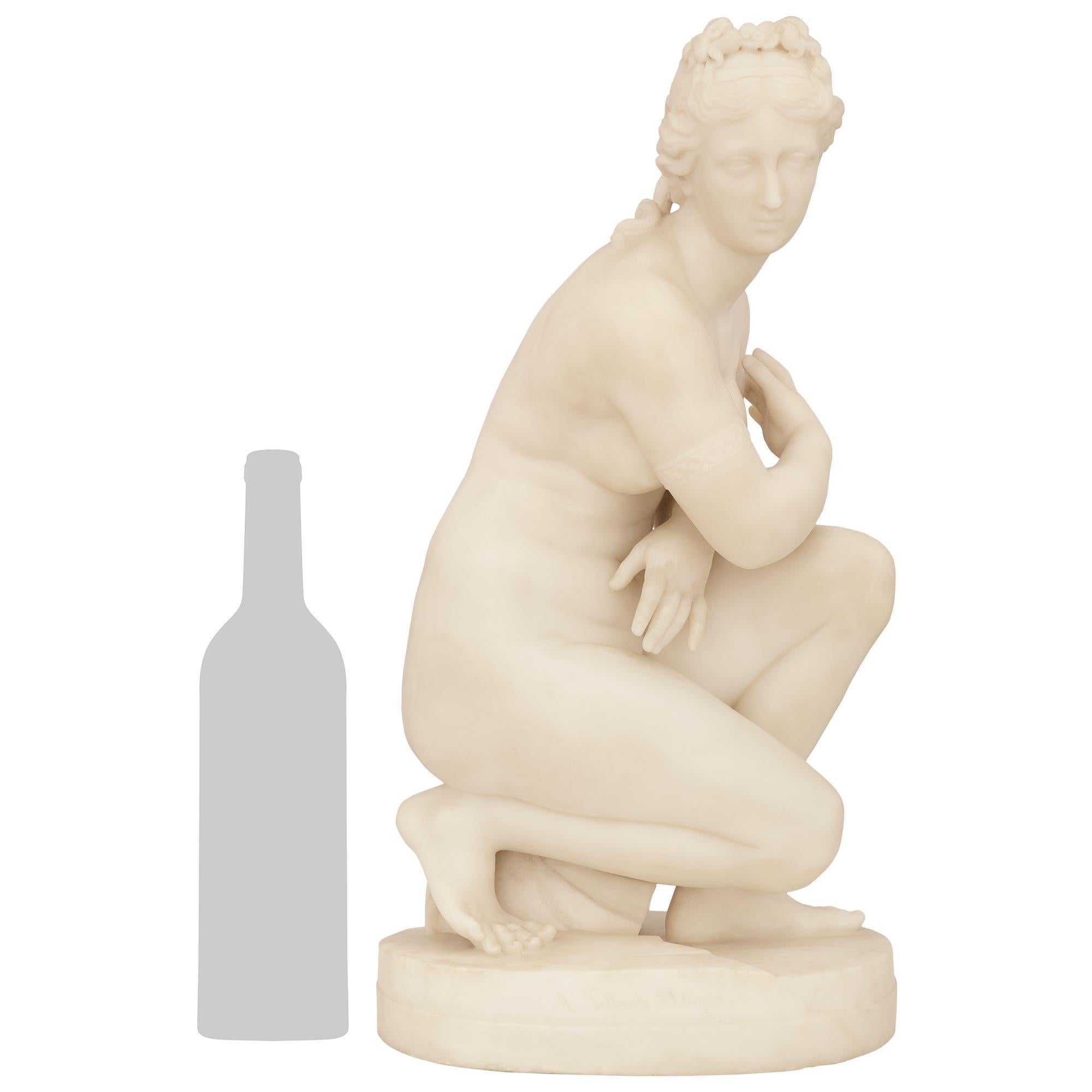 A wonderful and richly detailed Italian 19th century white Carrara marble statue of the Kneeling Venus, signed A. Pettrich Setilopia. This stunning statue is raised on an oval base with the front signature and displaying a rocky surface. Venus above
