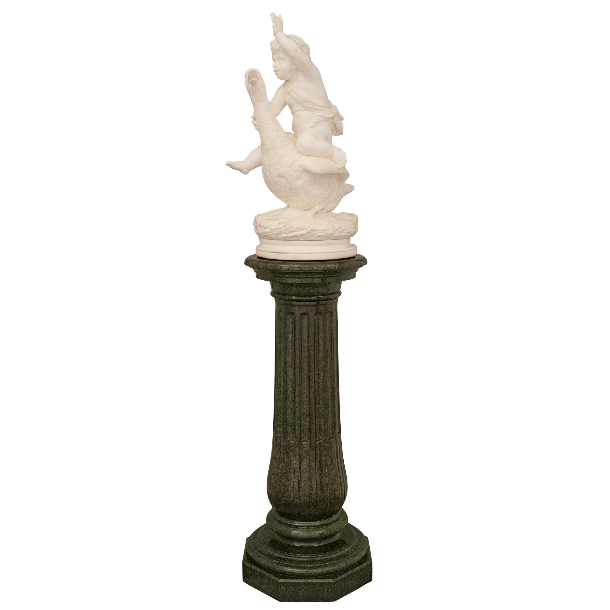 A stunning and very high quality Italian 19th century white Carrara marble statue on its original Vert de Patricia marble pedestal signed Barbieri. The statue is raised on its original most elegant Vert de Patricia marble pedestal column with a fine