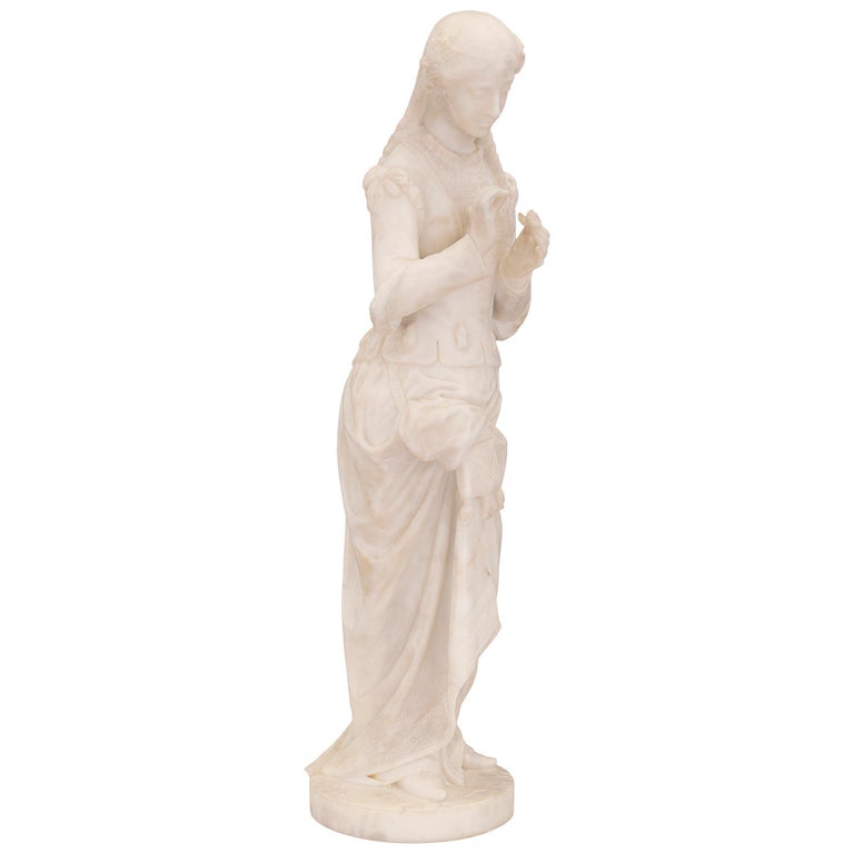 A stunning museum quality Italian 19th century white Carrara marble statue, signed P. Bazzanti Florence. The statue is raised by a circular base with a fine ground like design where the beautiful maiden is standing. She is draped in a wonderfully