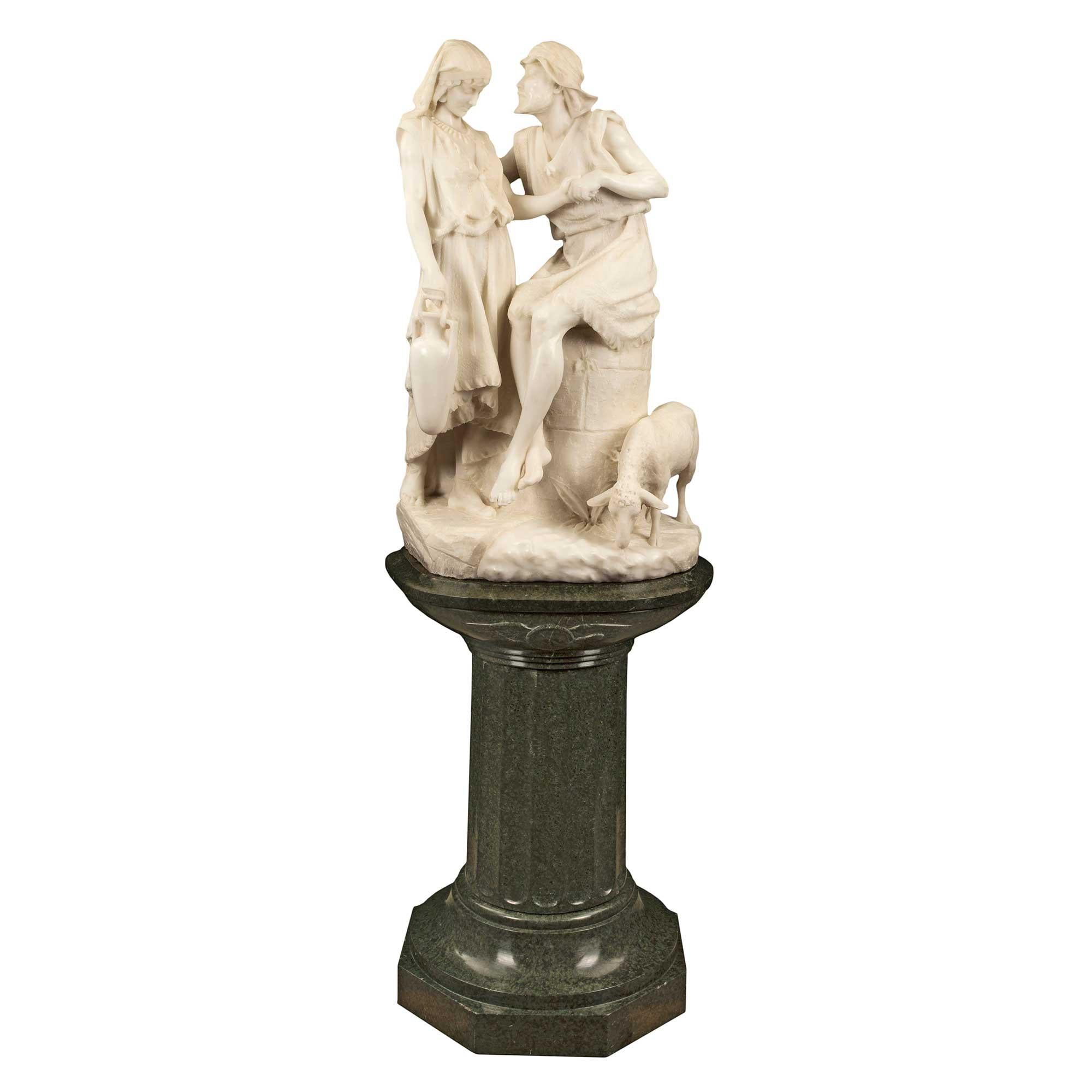 A highly acclaimed Italian 19th century white Carrara statue of 'Jacob and Rachel at the Well', signed R. Romanelli, Firenze. This sensational and extremely high quality statue is raised on its original Vert de Patricia marble swivel pedestal. The