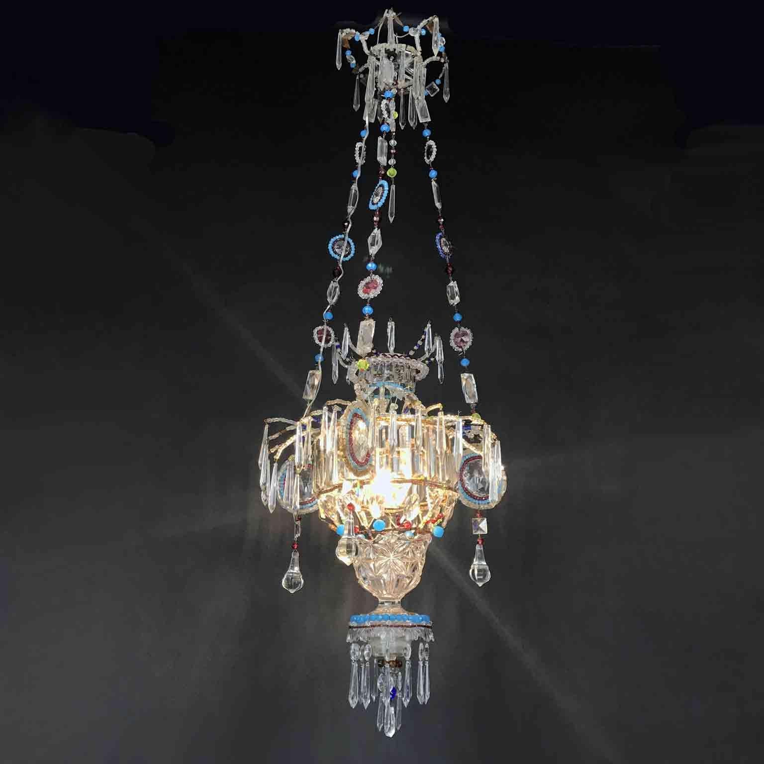 A charming hall lantern from Italy, a one of a kind beaded crystal and clear crystal one-light chandelier, decorated with ruby red and turquoise colored glasses and beads, coming from the entry of a private palazzo in Marche, a Central Italian