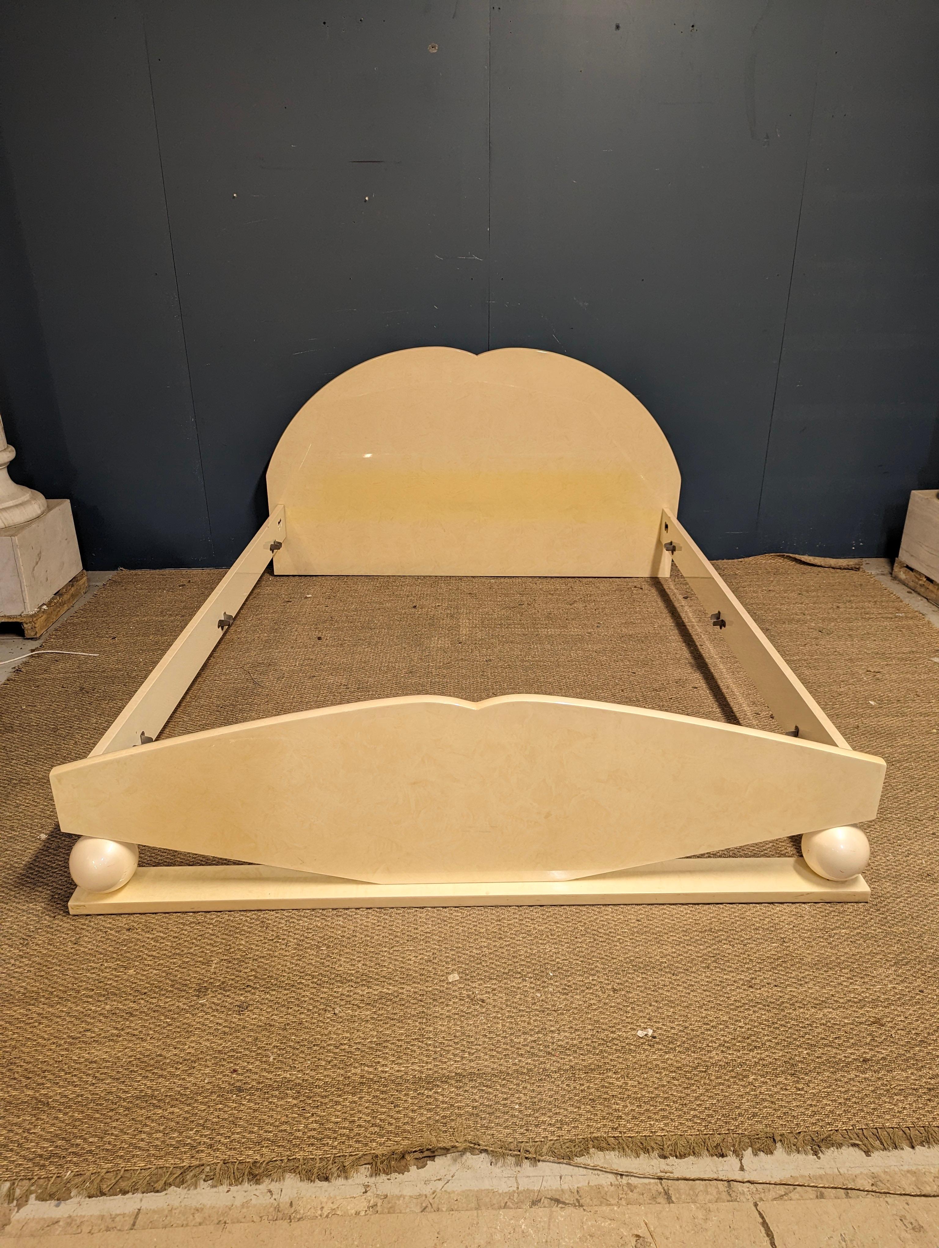 This Italian mid-20th century bed frame by Jean Claude Mahey captures the essence of mid-century modern sophistication with a touch of Italian flair. Expertly lacquered, the frame boasts a glossy, mirror-like finish that enhances its clean lines and