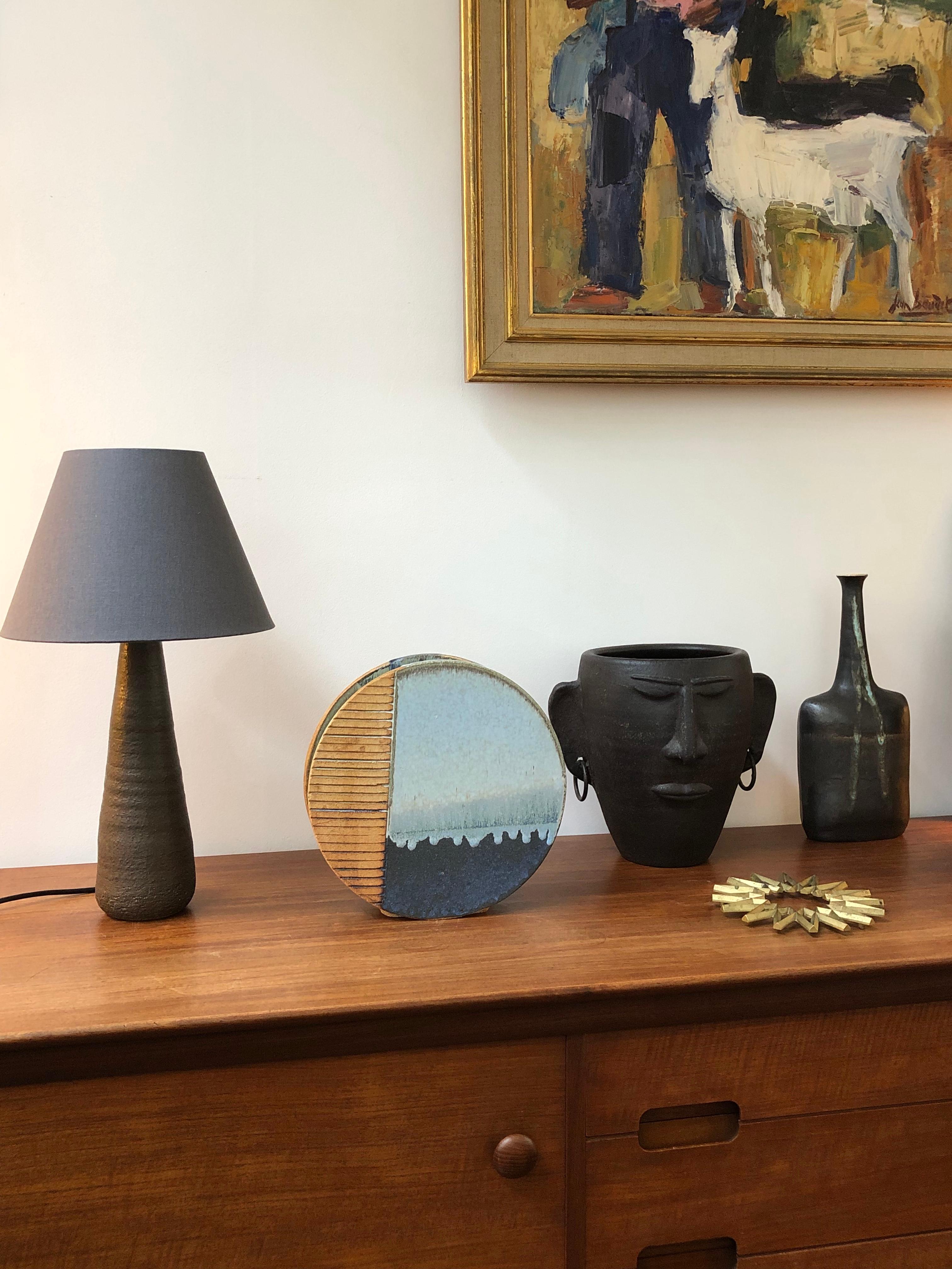 Italian 20th century modern ceramic vase (circa 1970s). A highly original wheel-shaped ceramic vase with three-finish exterior. Each surface is quite distinctive and provides a layer of interest visually and texturally. On the left is a linear