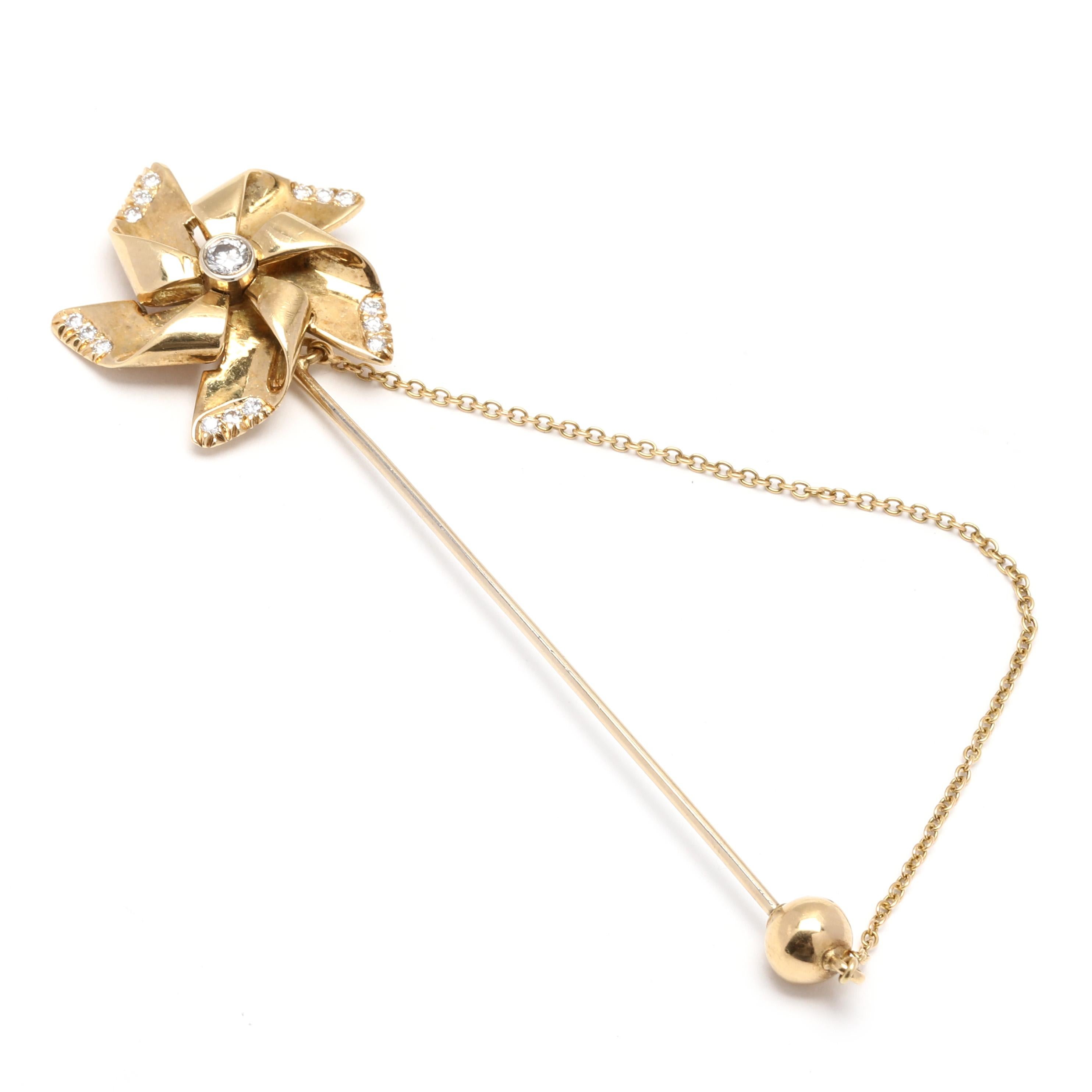 These Italian .33ctw Diamond Pinwheel Jabot Pin is an exquisite piece crafted from 18K yellow gold. The pin features a beautiful pinwheel design with sparkling diamond accents. The diamonds have a total carat weight of .33ctw and add a touch of