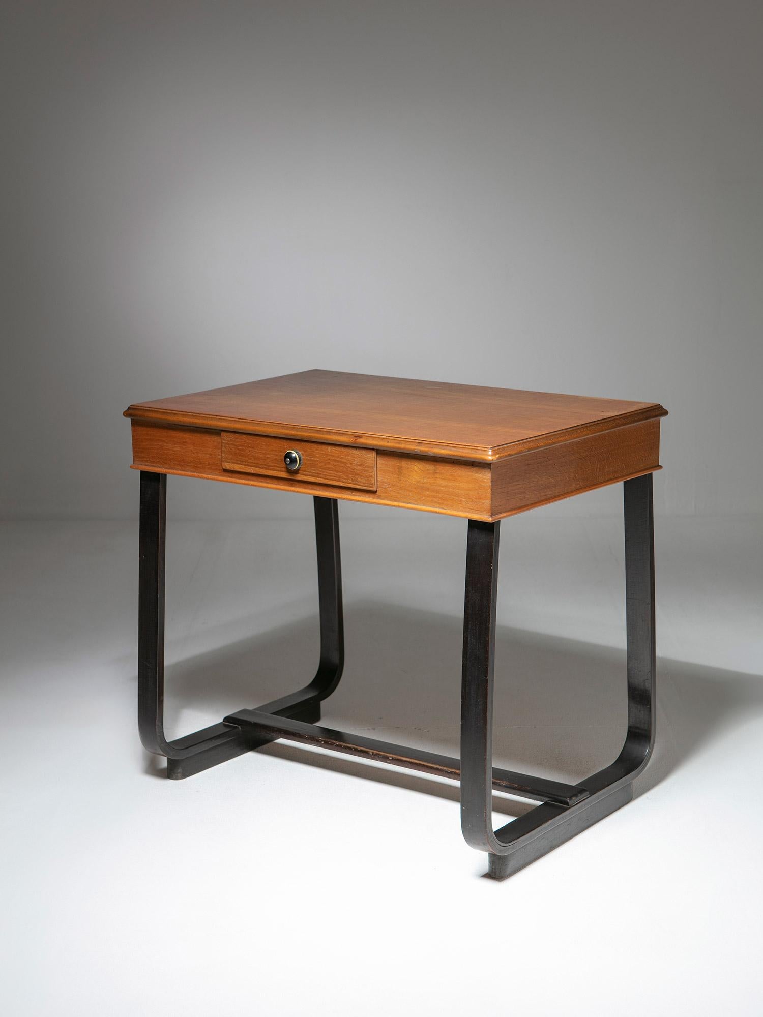 Italian 1940s desk featuring plywood legs and one drawer.
Shape and proportions resemble the work of Giuseppe Pagano.