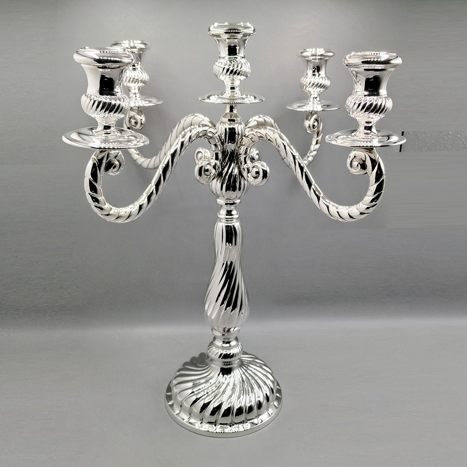 Large candelabra in solid 800 silver with 5 lights and is the Torchon style, made in Milan - Italy in the last quarter of the 20th century by Gabriele Tortini for ARVAL ARGENTI VALENZA.
The candelabra was made entirely of embossed and chiseled