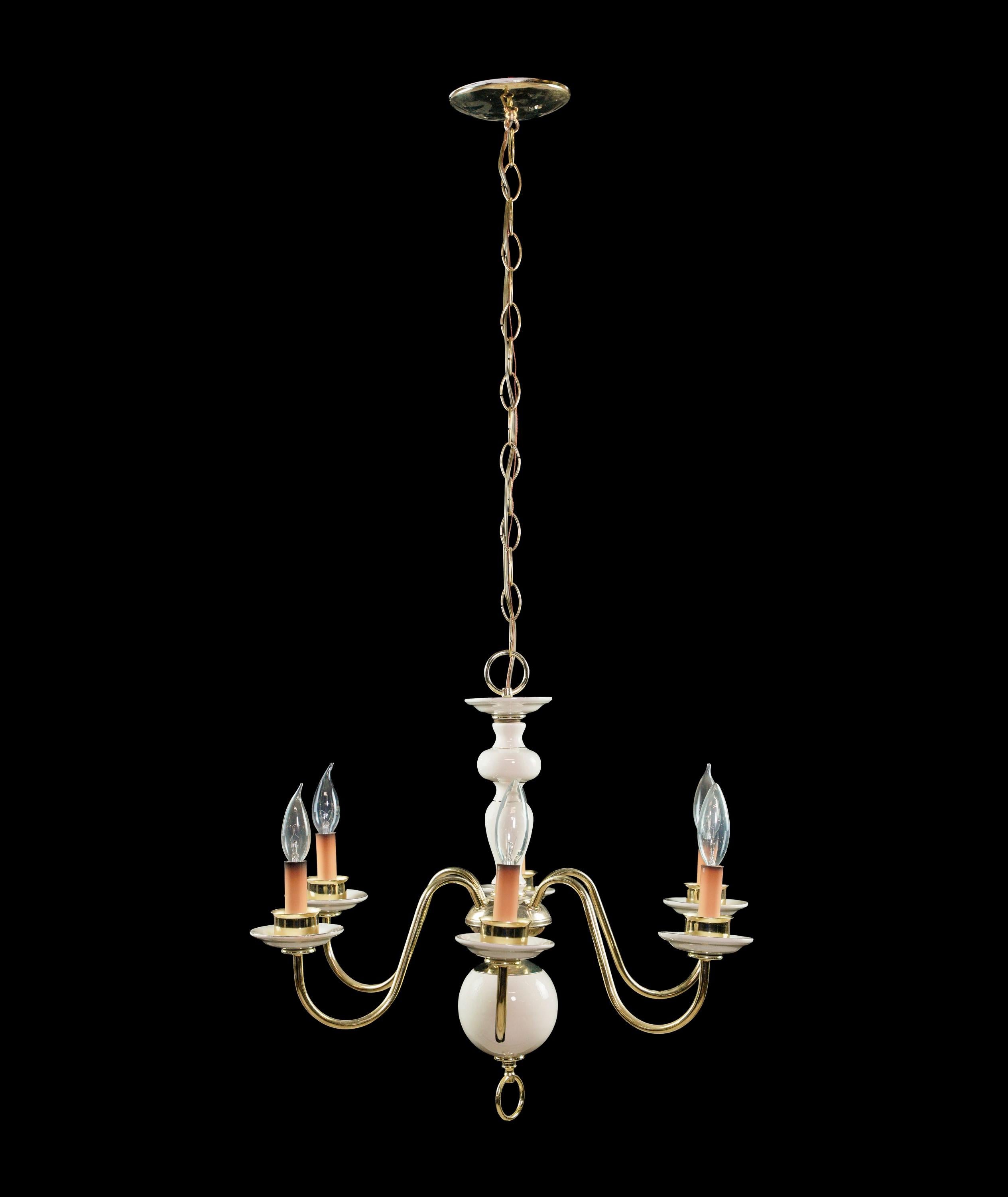 White and gold ceramic six arm chandelier with a polished brass plated steel frame and pinkish colored candelabra sockets. Cleaned and restored. There are some imperfections in the porcelain, but this is in overall good condition. Please note, this