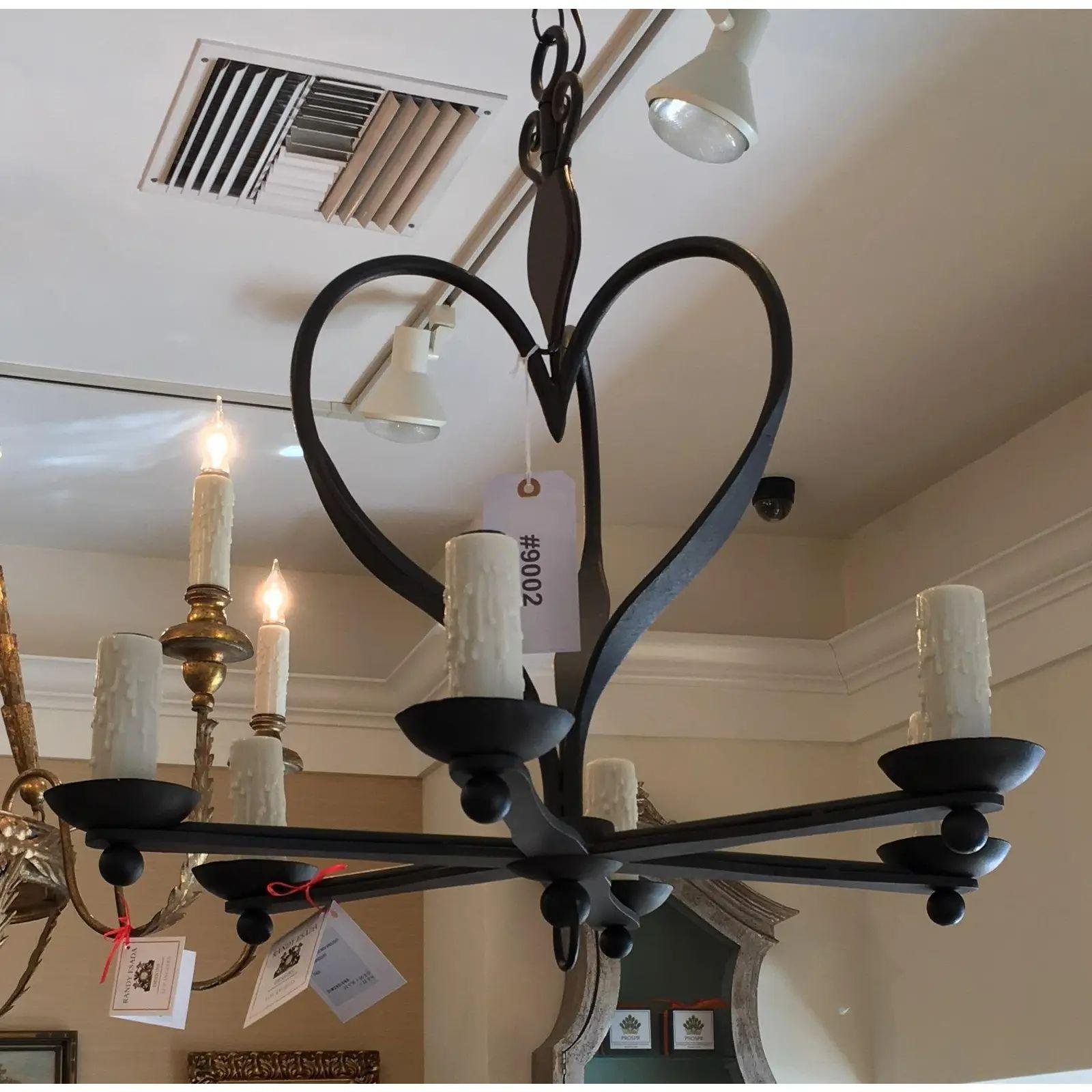 This lovely chandelier is a genuine designer fixture and features 6 lights and an unusual heart form.

Sevilla Chandelier (6-Arm).
Matching canopy included as shown in image.
Finish: Aged iron.
Height w/canopy - w/o chain

Additional information: