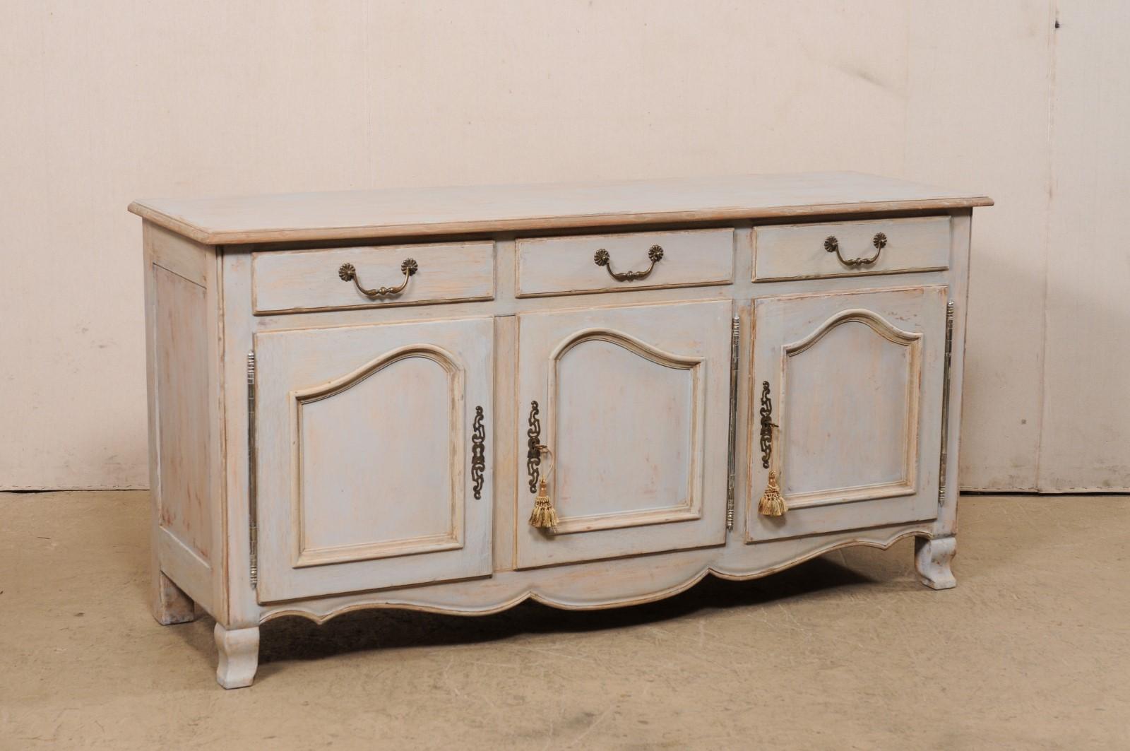 A painted wood sideboard buffet, made in Italy for Bloomingdales. This vintage cabinet from Italy, approximately 6 feet in length, features a rectangular-shaped top above a case which houses three drawers set horizontally at top, over three