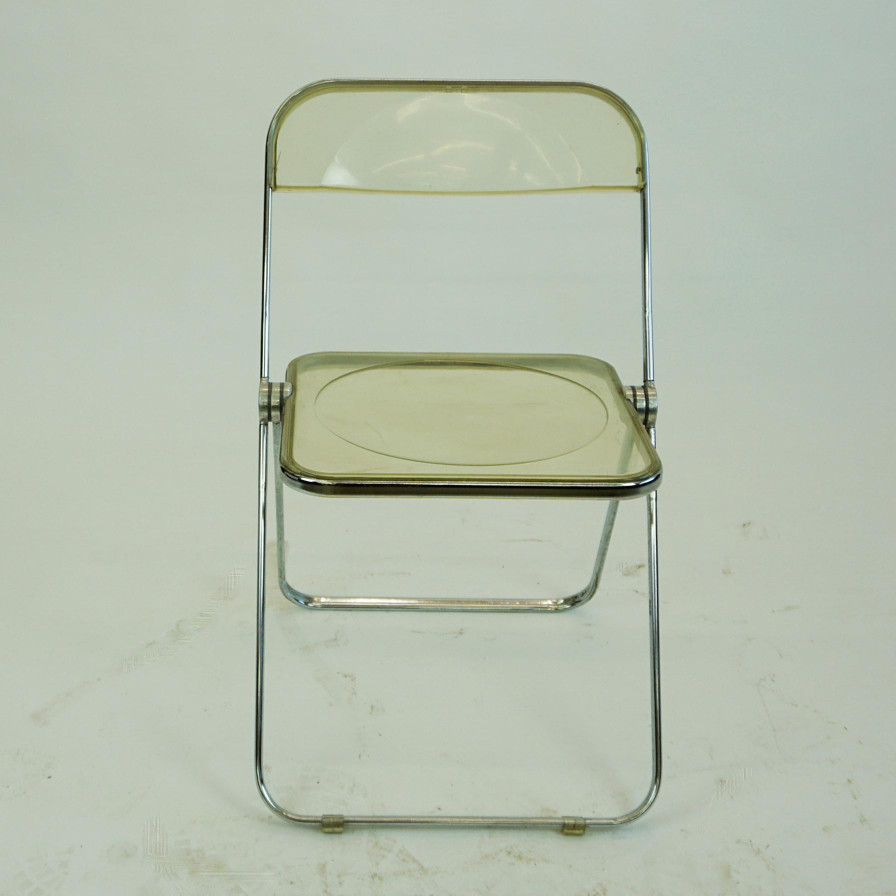 Set of four iconic Italian Mid-Century Modern folding chairs in Lucite and chrome, designed by Giancarlo Piretti 1967 for Anonima Castelli, Italy. The Plia folding chair is a real design Classic as it won several prices and is part of the MoMA