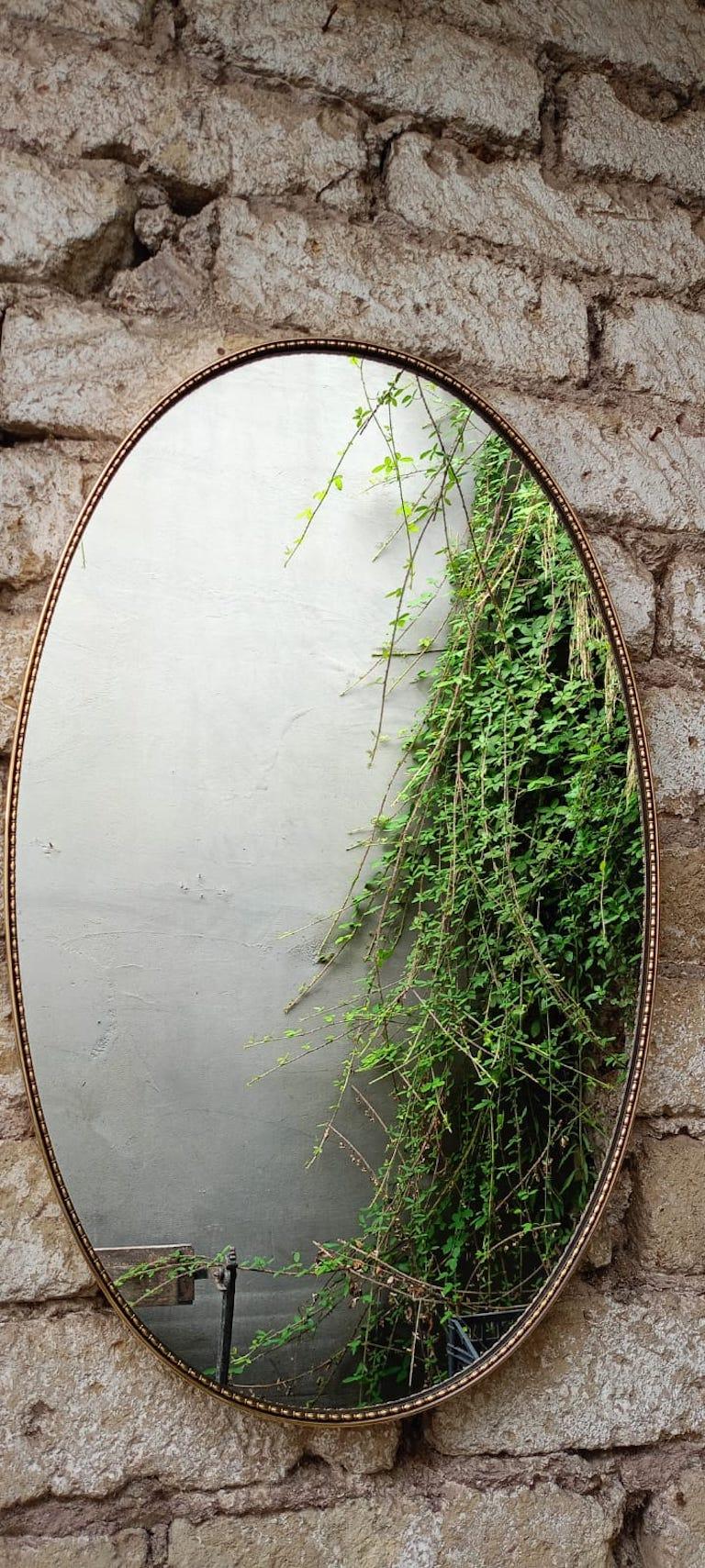 Mid-Century Modern Italian 60's Oval Wall Mirror In Brass Frame. Italy For Sale