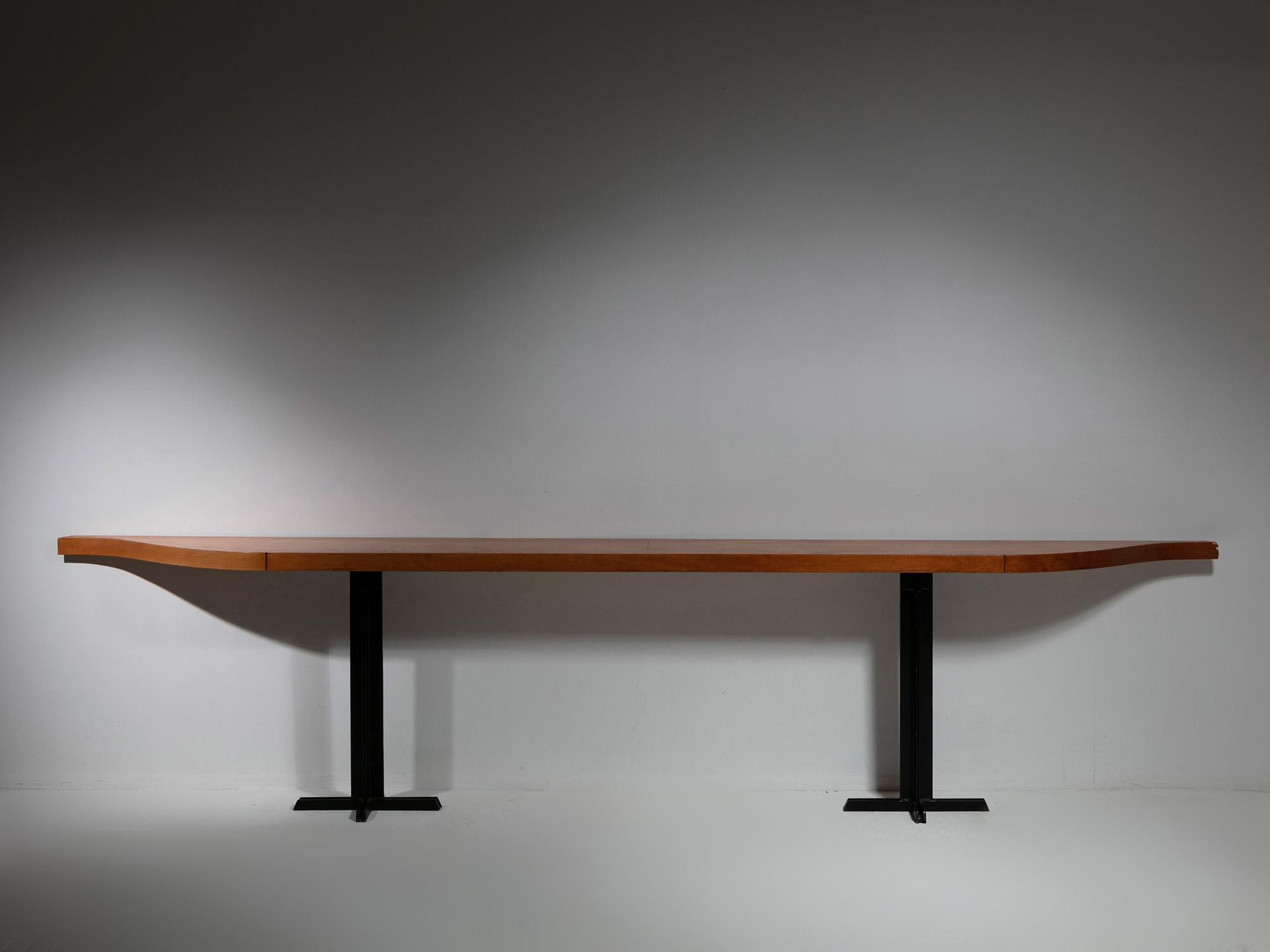 Large cherry wood console.
Long top with gently shaped ends, supported by a couple of black iron elements.