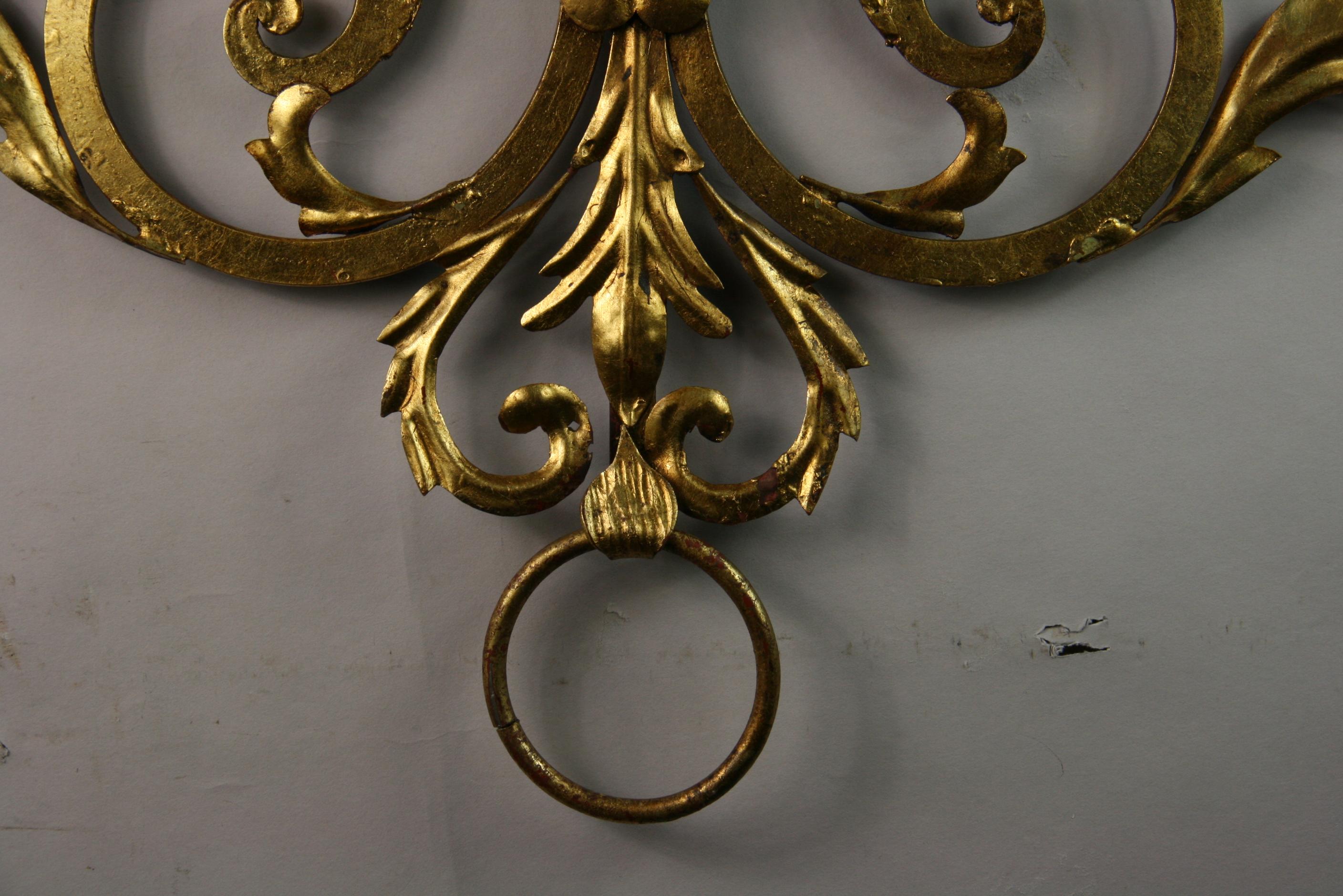 8-157 Italian gilt metal and wood 7-light candle sconce with foil details.
Large size lends itself as an elaborate wall sculpture.