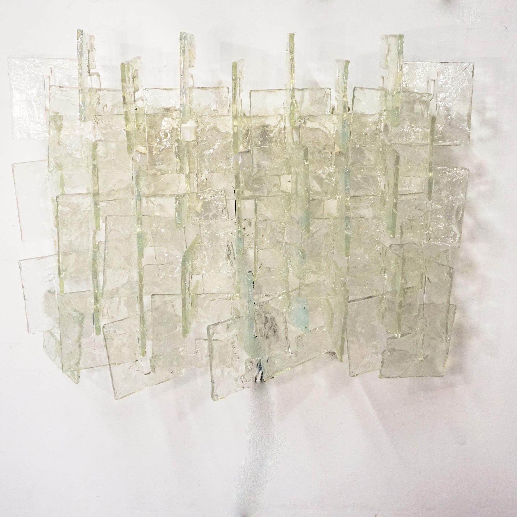 Fantastic large and rare vintage wall light by Carlo Nason for Mazzega, produced in Murano Italy in the 1970s. The Interlocking Murano glass pieces can be linked together. They are made of excellent textured handblown murano glasses and are mounted