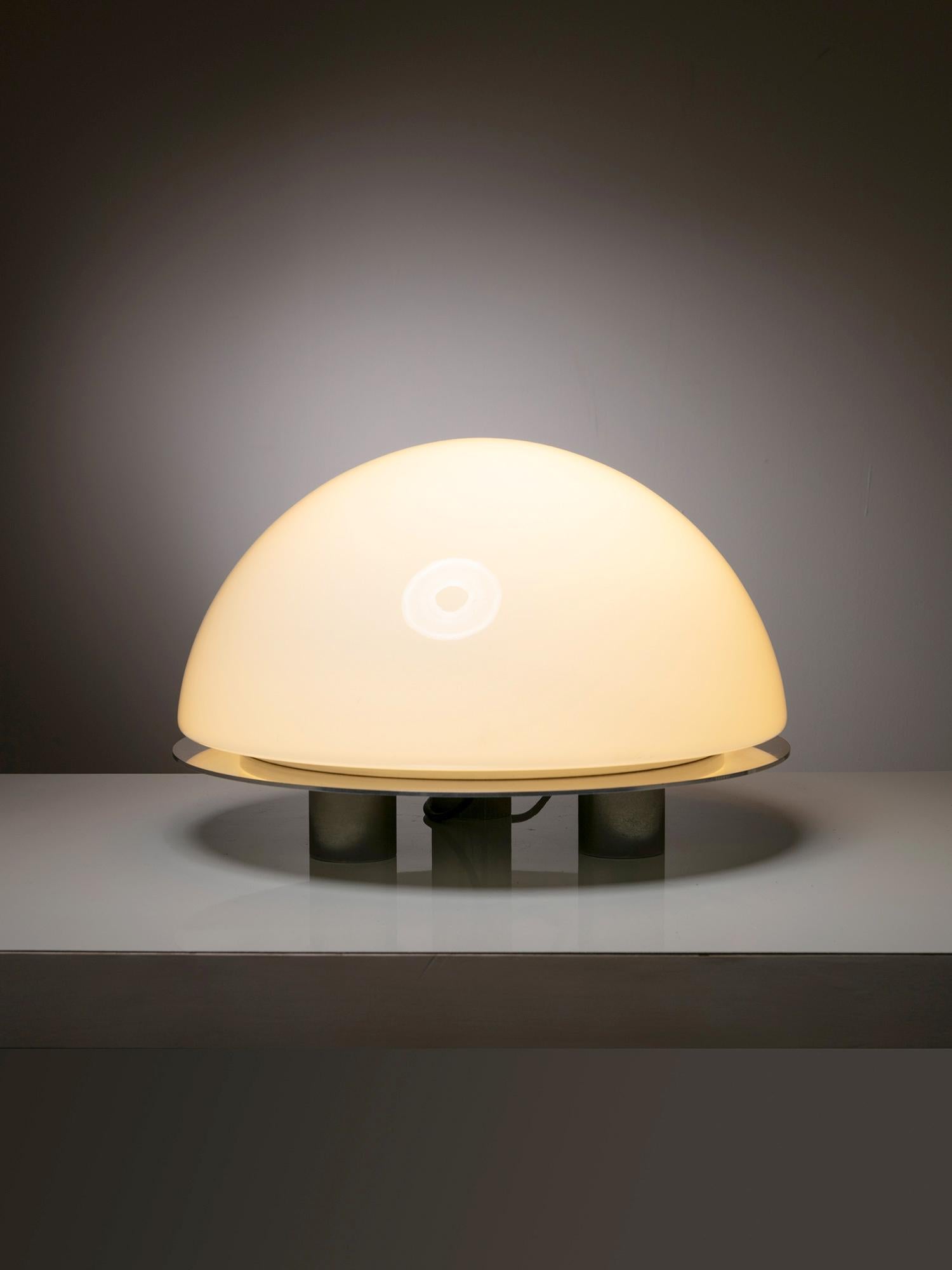 Italian 70s table lamp.
Round steel disc supports a large opaline glass shade.