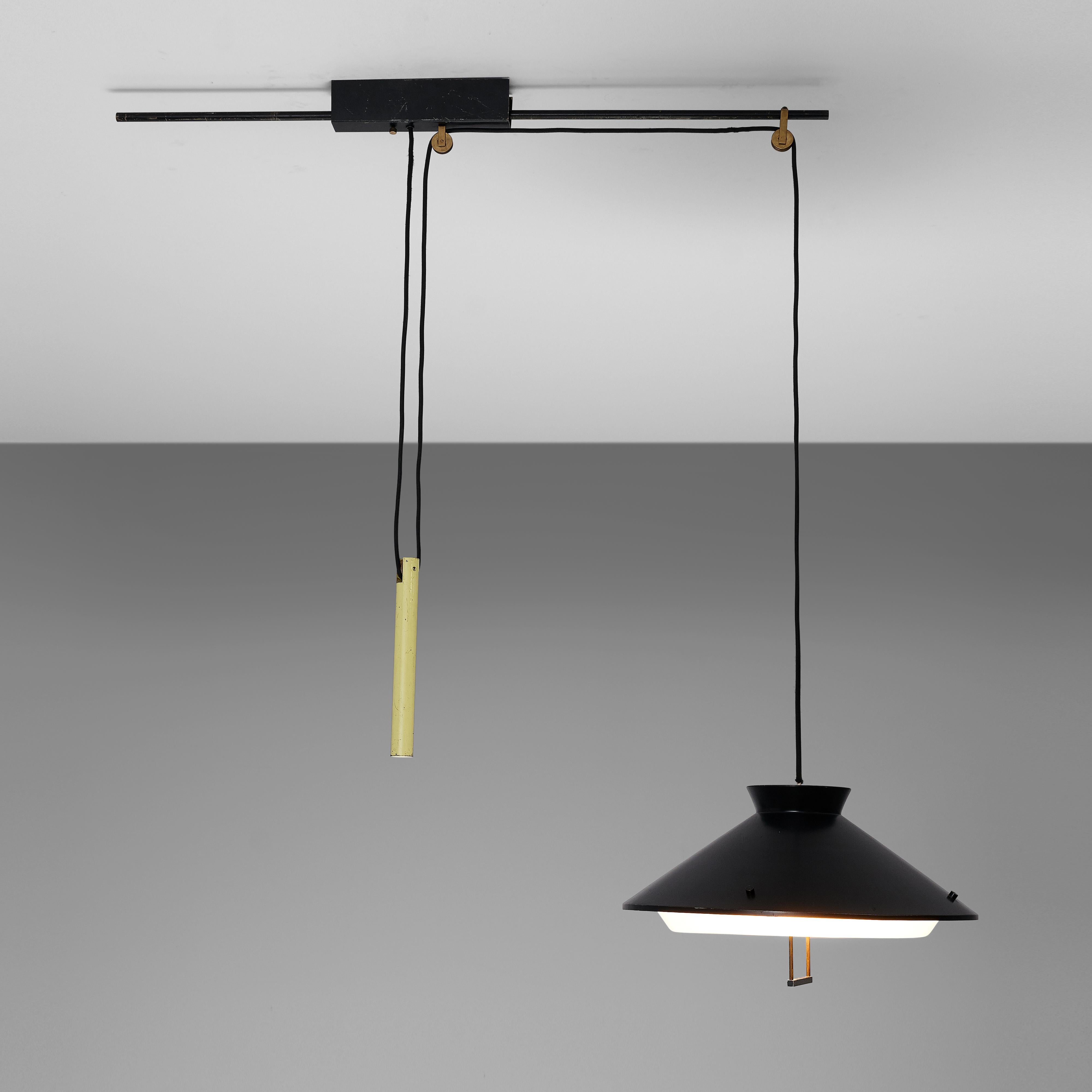 Pendant lamp with adjustable counterweight, black and yellow lacquered metal, brass, wiring, plastic, Italy, 1960s

This ceiling lamp is an excellent example of the 'new style' Italian lighting designs of the 1950s and 1960s. Executed in a fashion