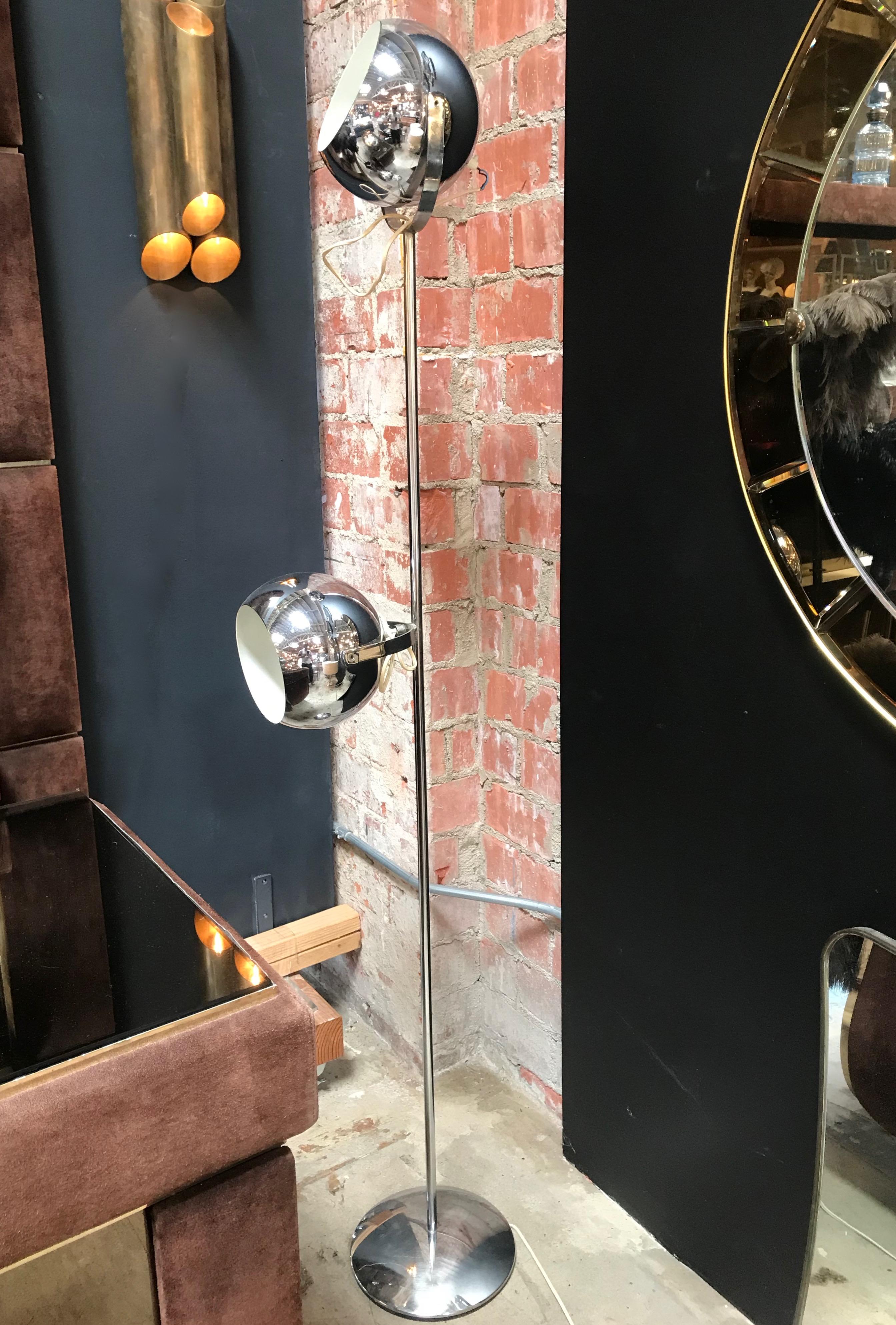 A handsome and practical design, this chrome floor lamp has two adjustable shades which can offer, direct, indirect, or ambient light.