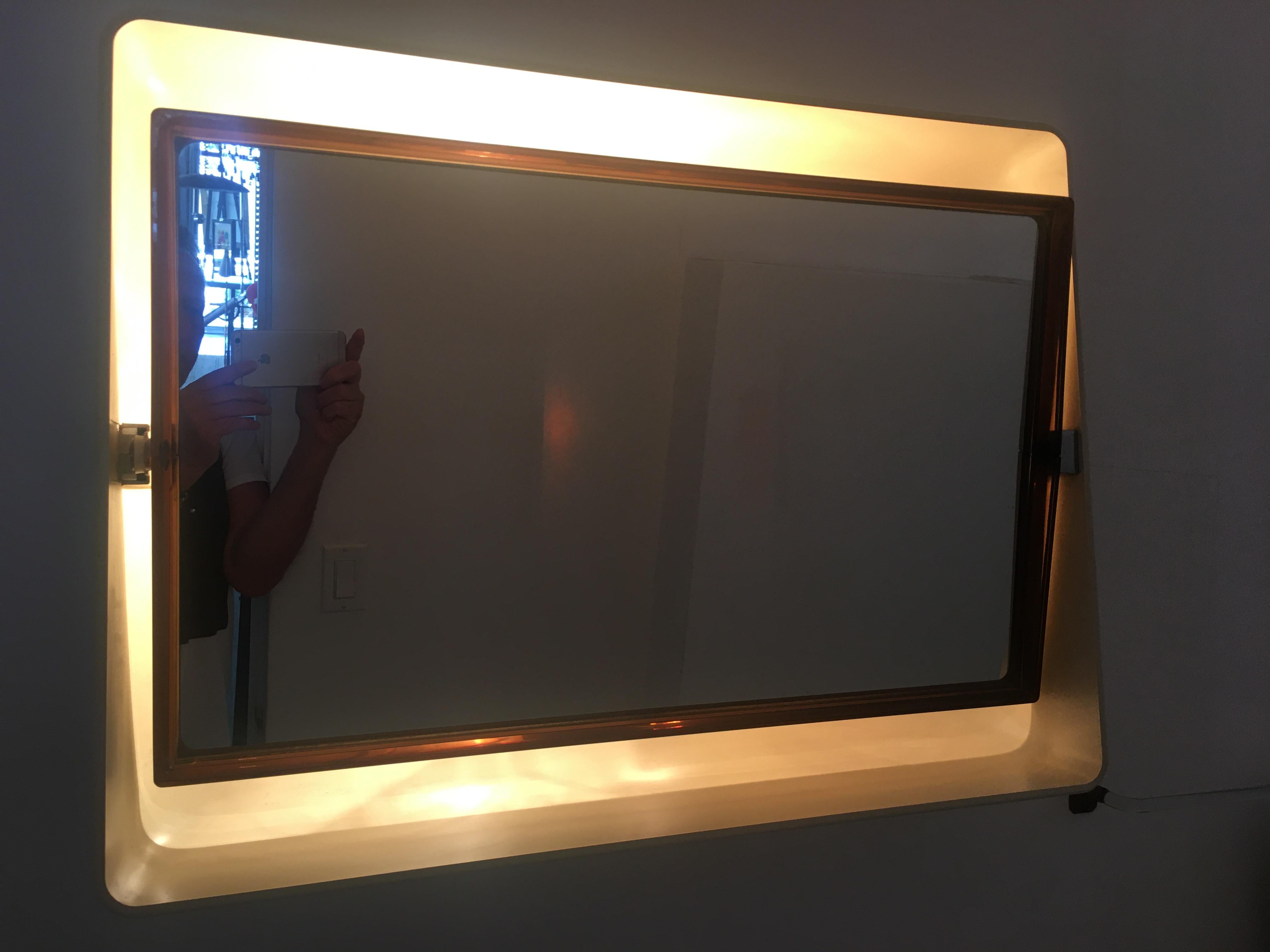 One of kind adjustable lighted mirror, with heavy molded Plexiglass. Italy, 1960s.