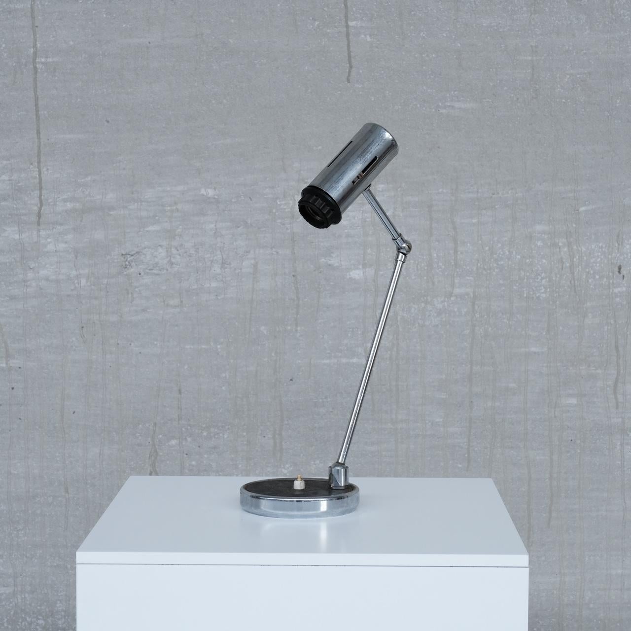 An adjustable table lamp. 

Likely Italian, c. 1960s. 

Would look great with an edison bulb. 

Since re-wired and PAT tested. 

Good condition, some scuffs and wear commensurate with age. 

Location: Belgium Gallery. 

Dimensions: 46.5